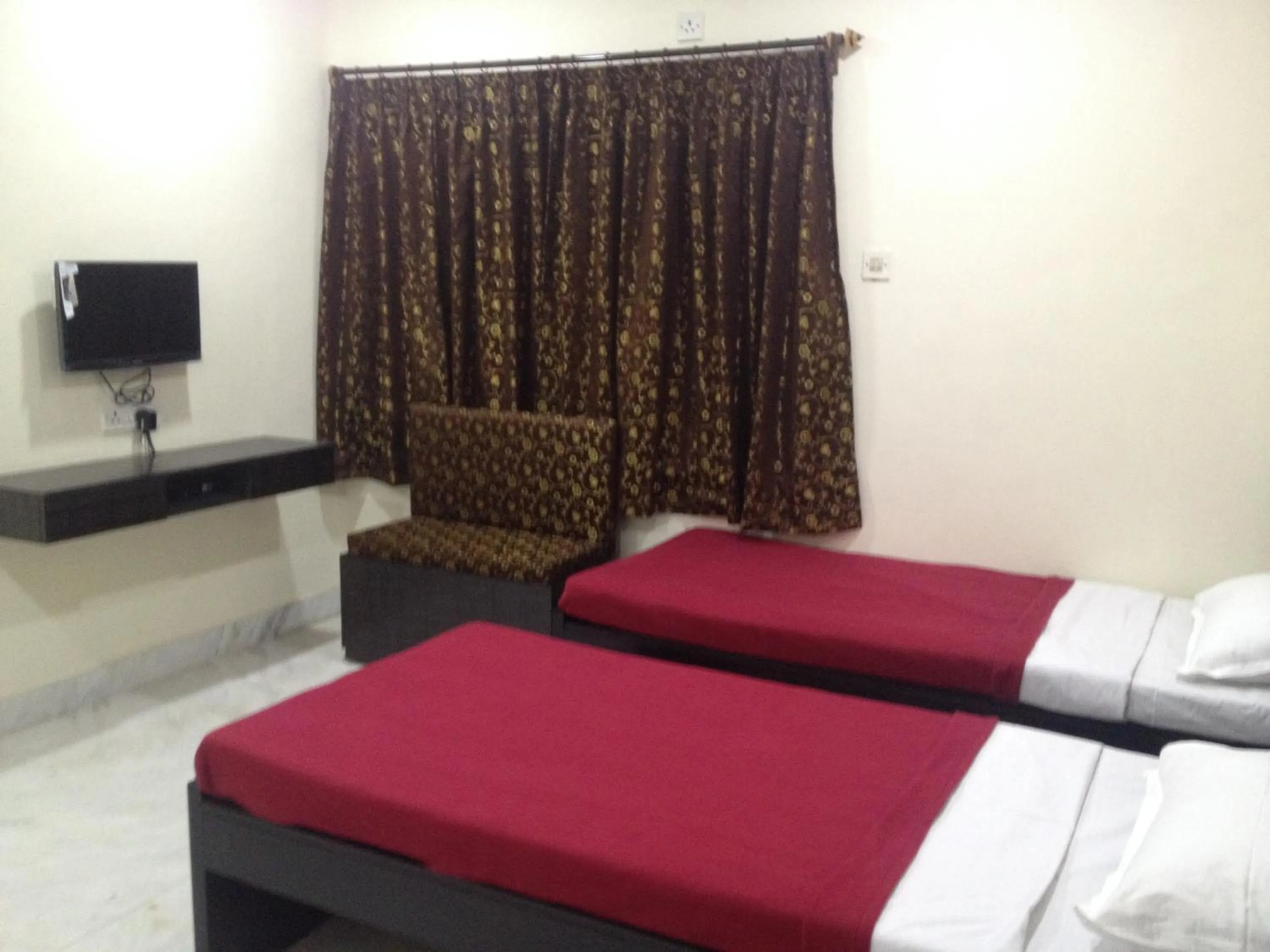 Bed in Hotel Nest International