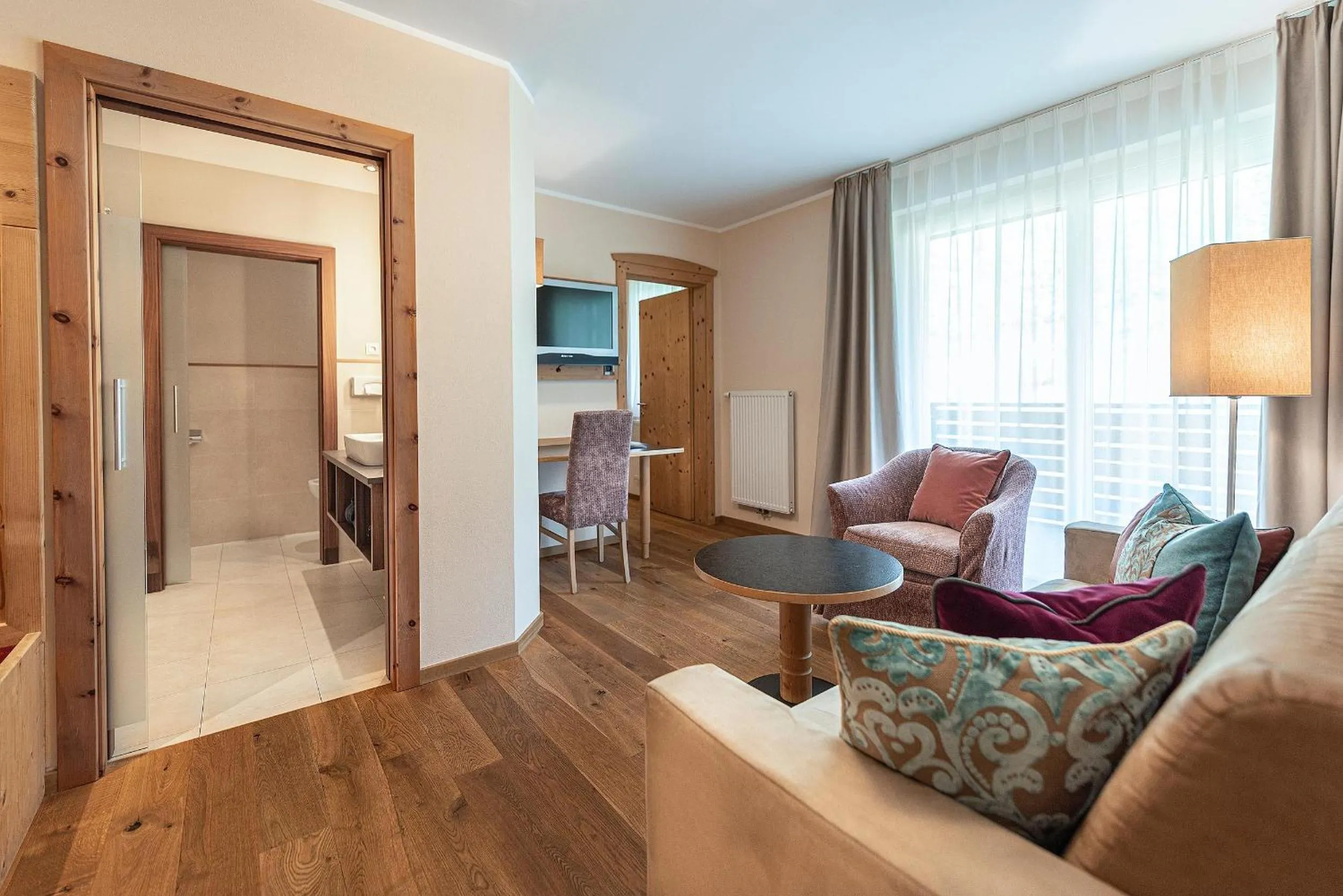 Communal lounge/ TV room in Vitalpina Hotel Waldhof