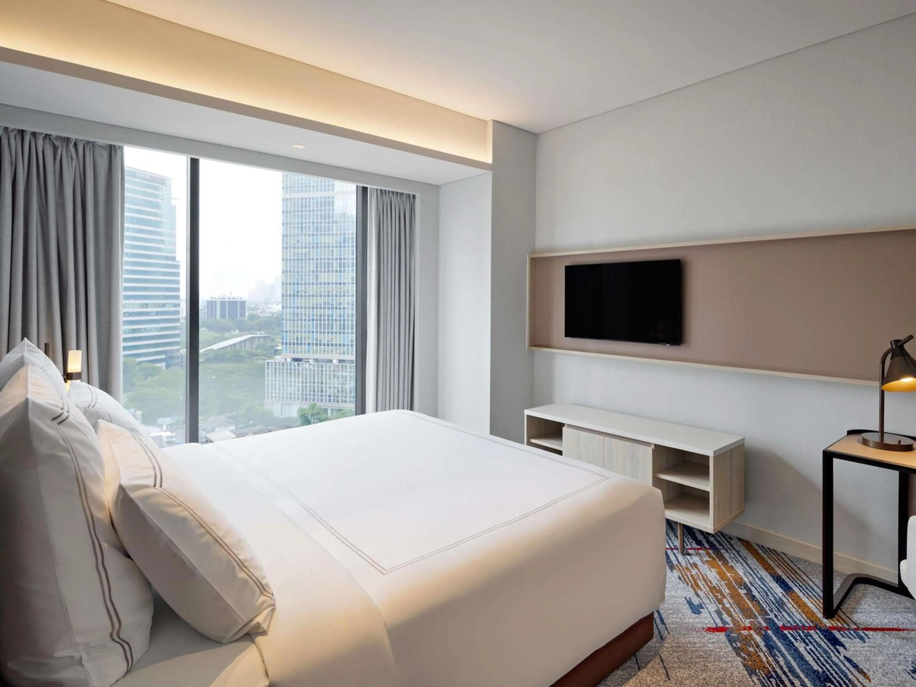 Bedroom, Bed in Swissôtel Living Jakarta Mega Kuningan