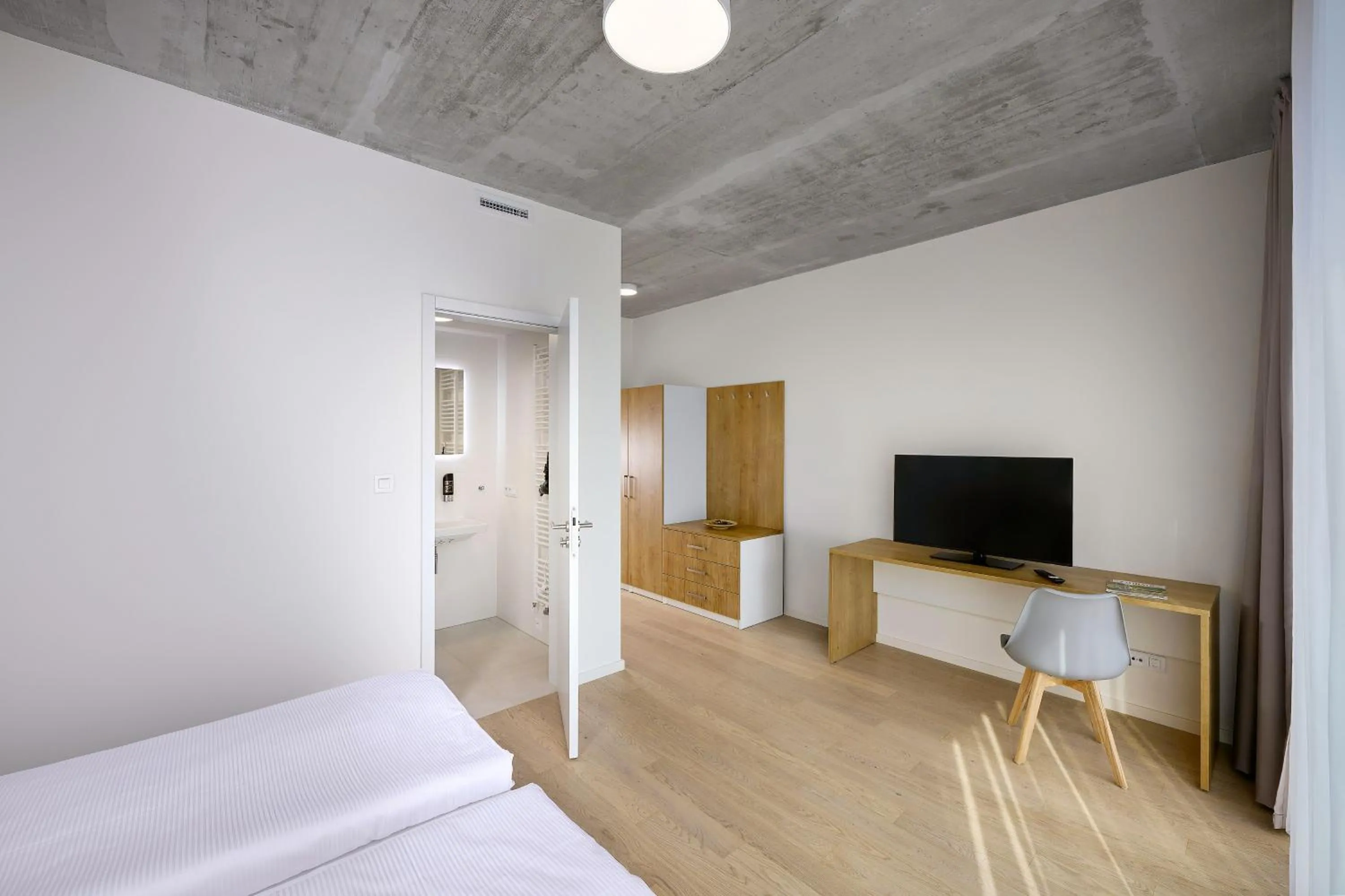 Bed in DownTown Suites Andel