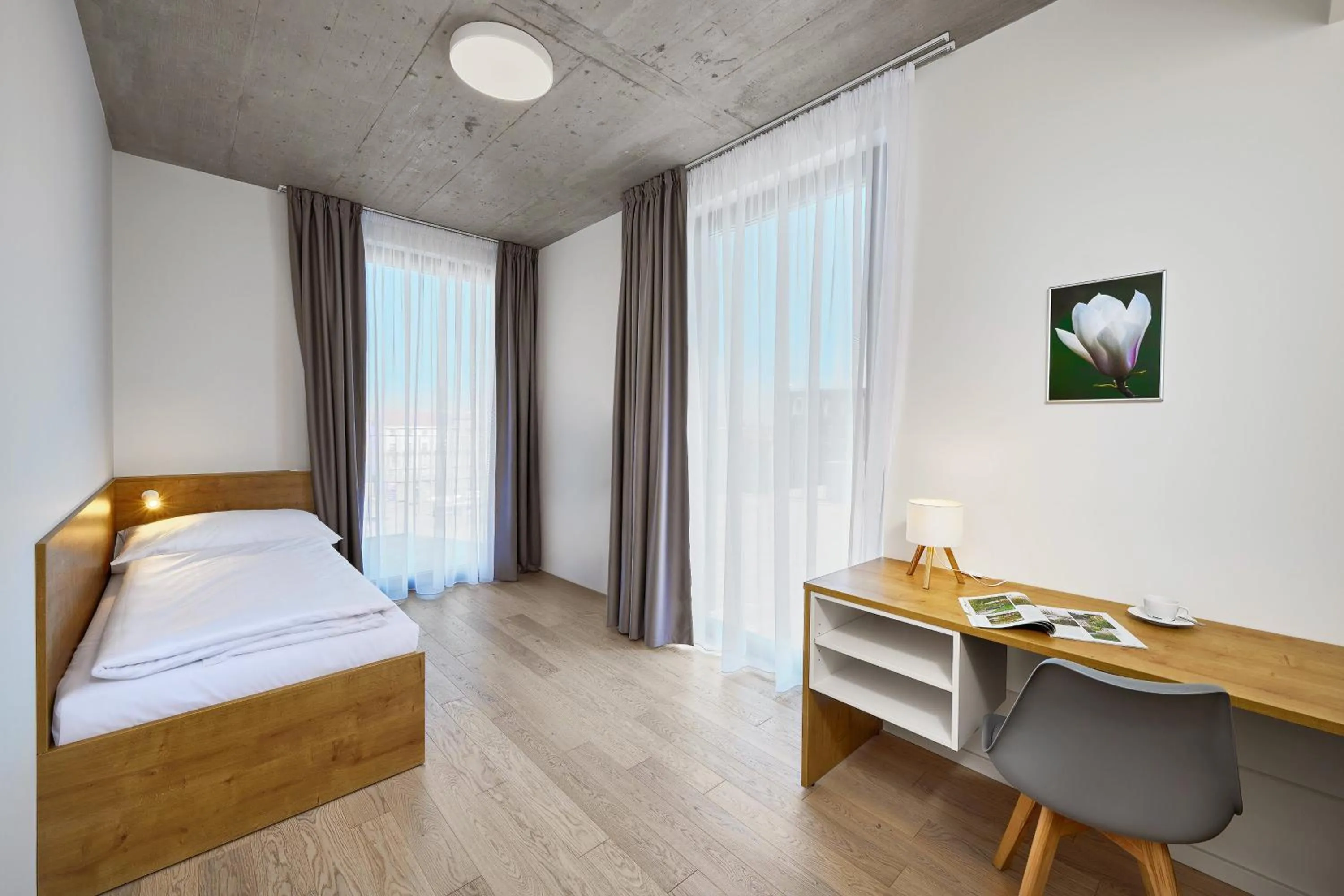 Bed in DownTown Suites Andel