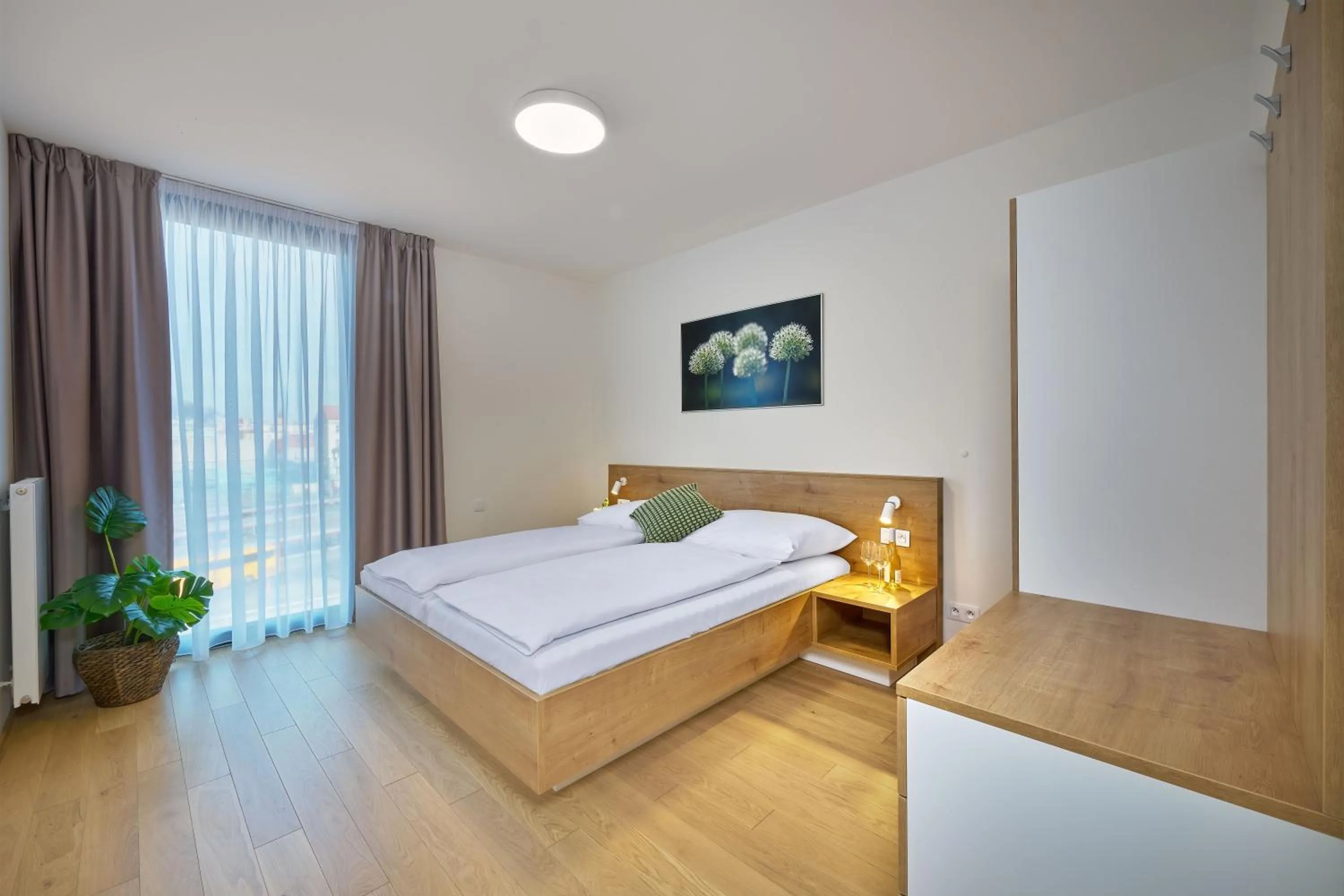 Bed in DownTown Suites Andel