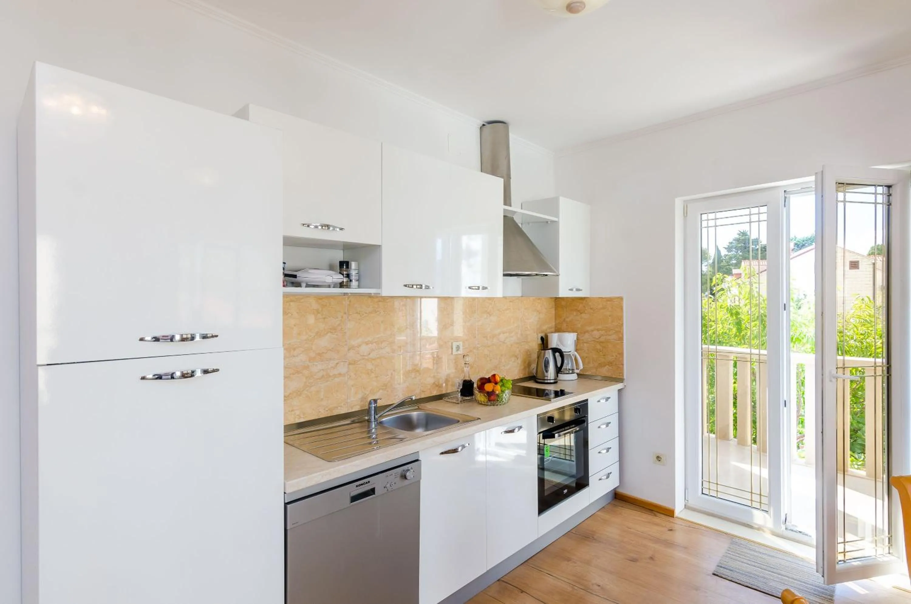 Kitchen or kitchenette in Apartments & Rooms V&M