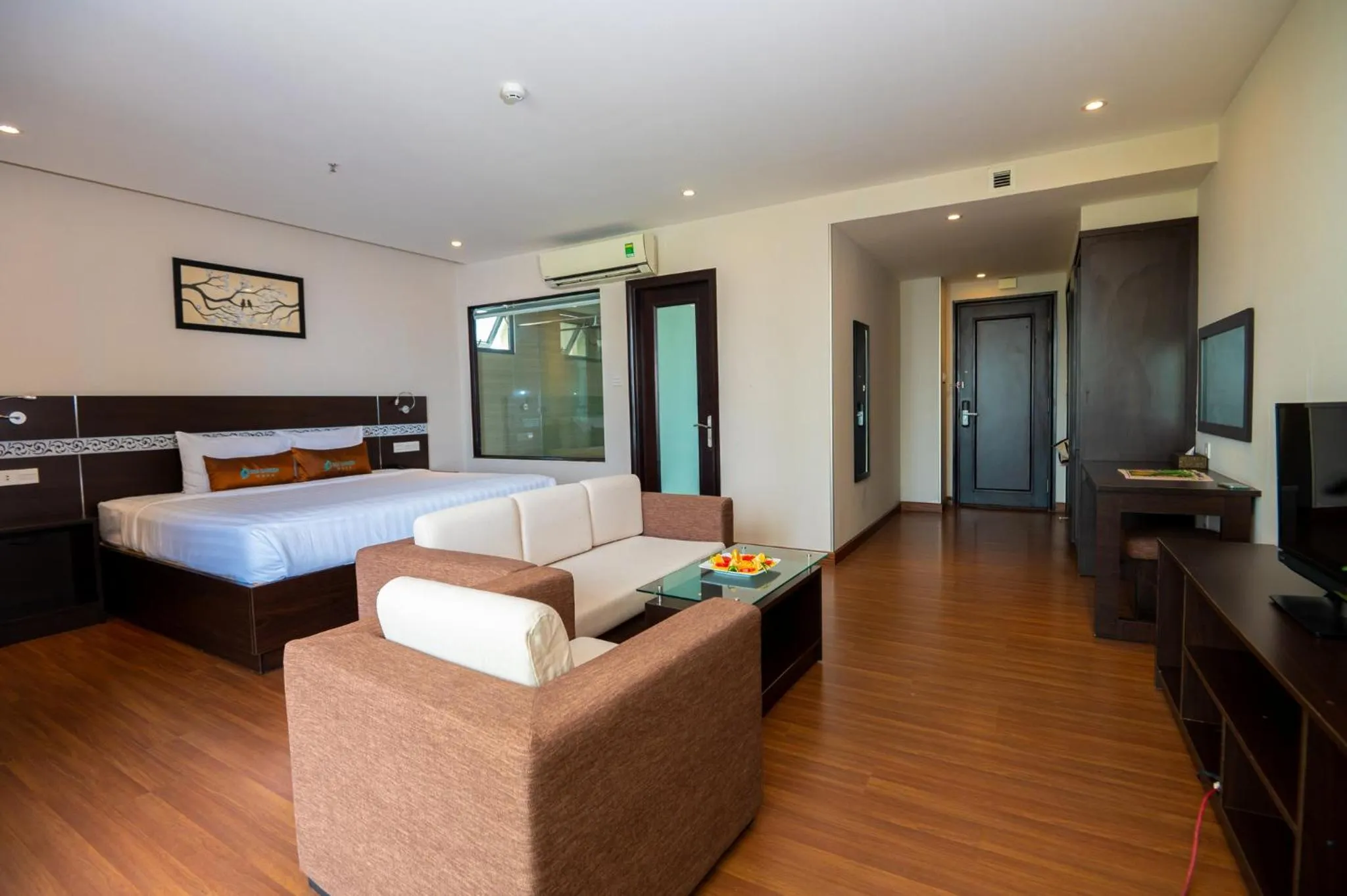 Seating area, Bed in Sea Garden Hotel