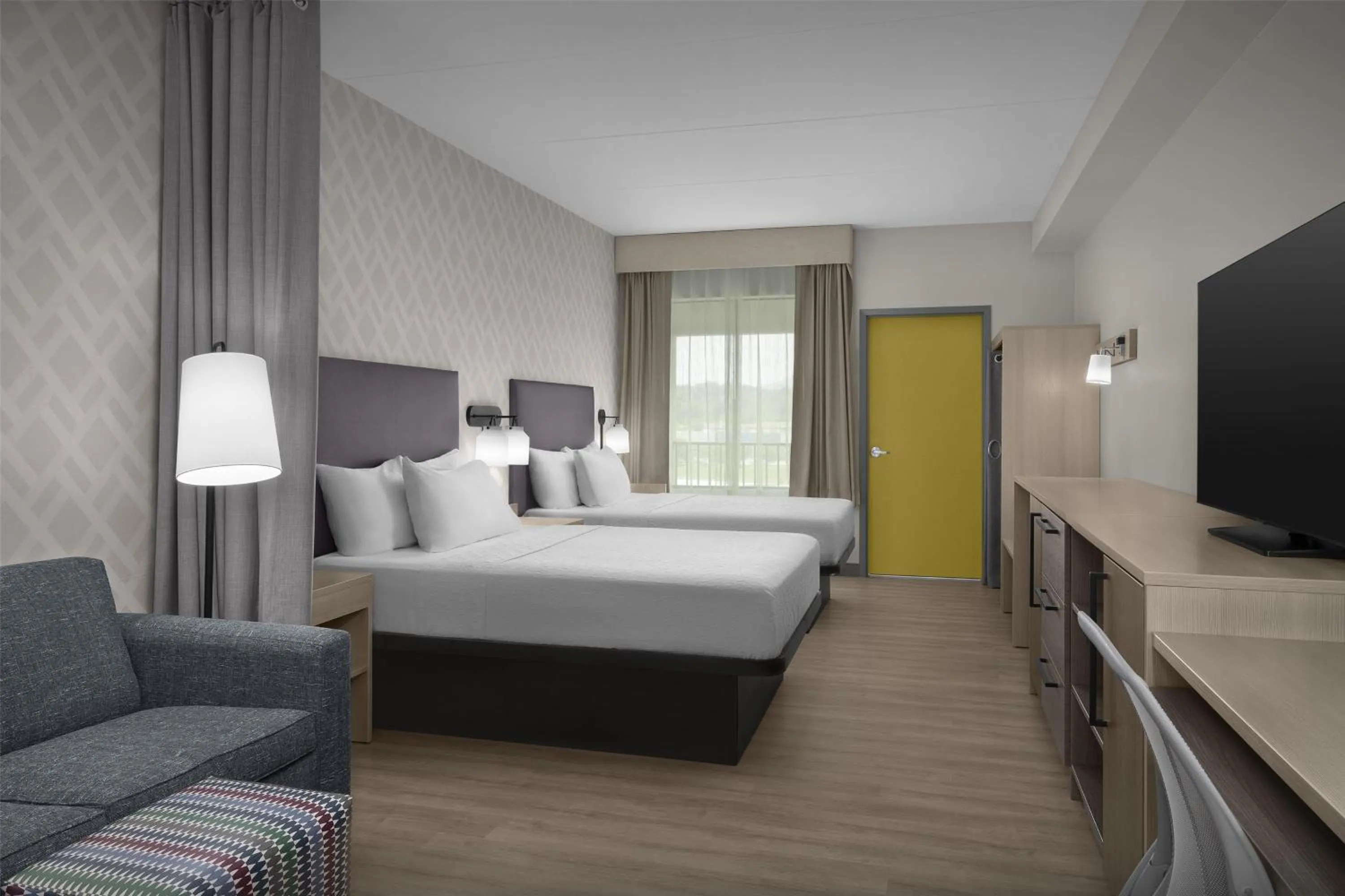 Living room, Bed in Home2 Suites By Hilton Sevierville