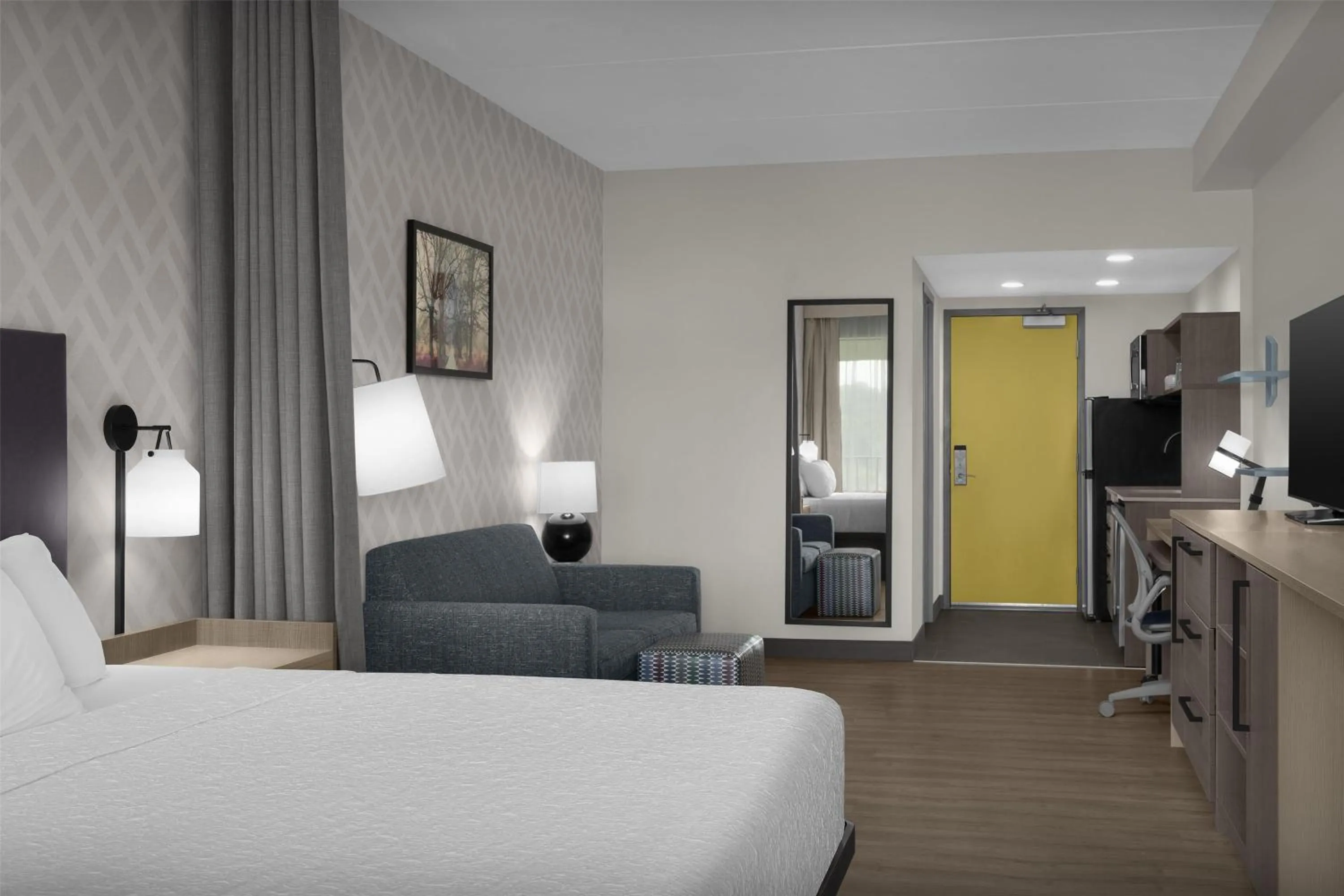 Living room, Bed in Home2 Suites By Hilton Sevierville