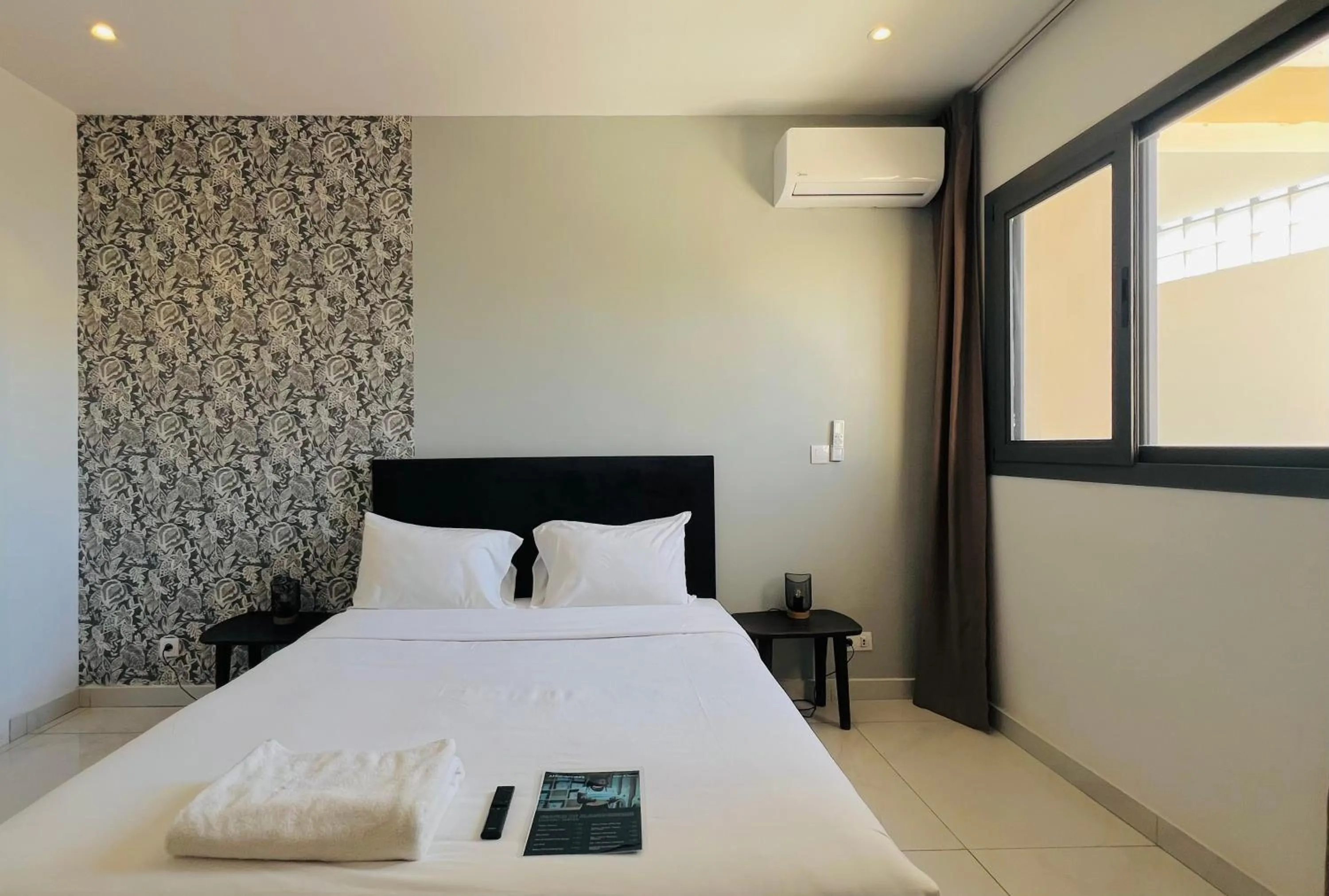 Bed in AfricaWorks Suites