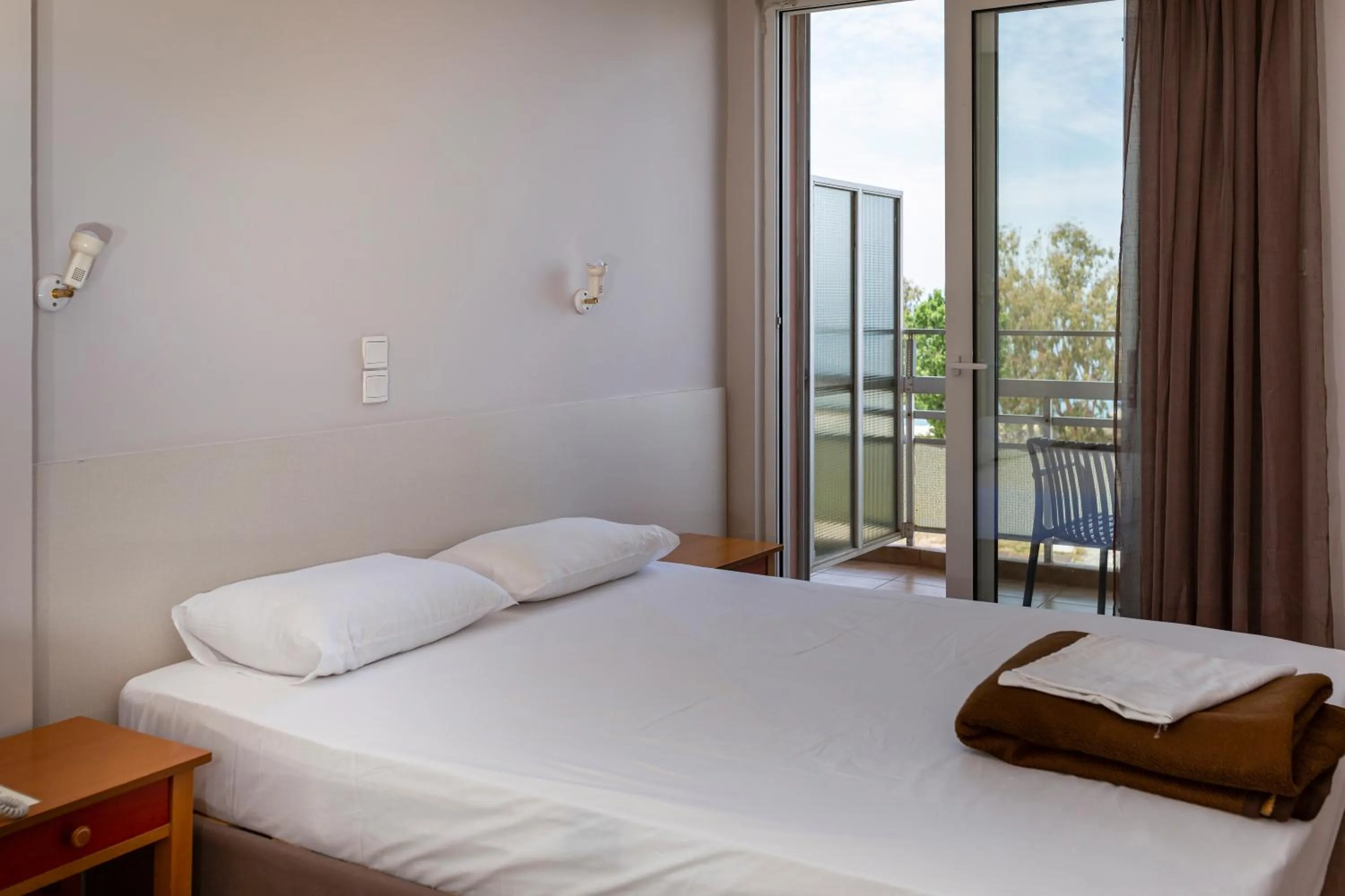 Bed in Delfini Hotel