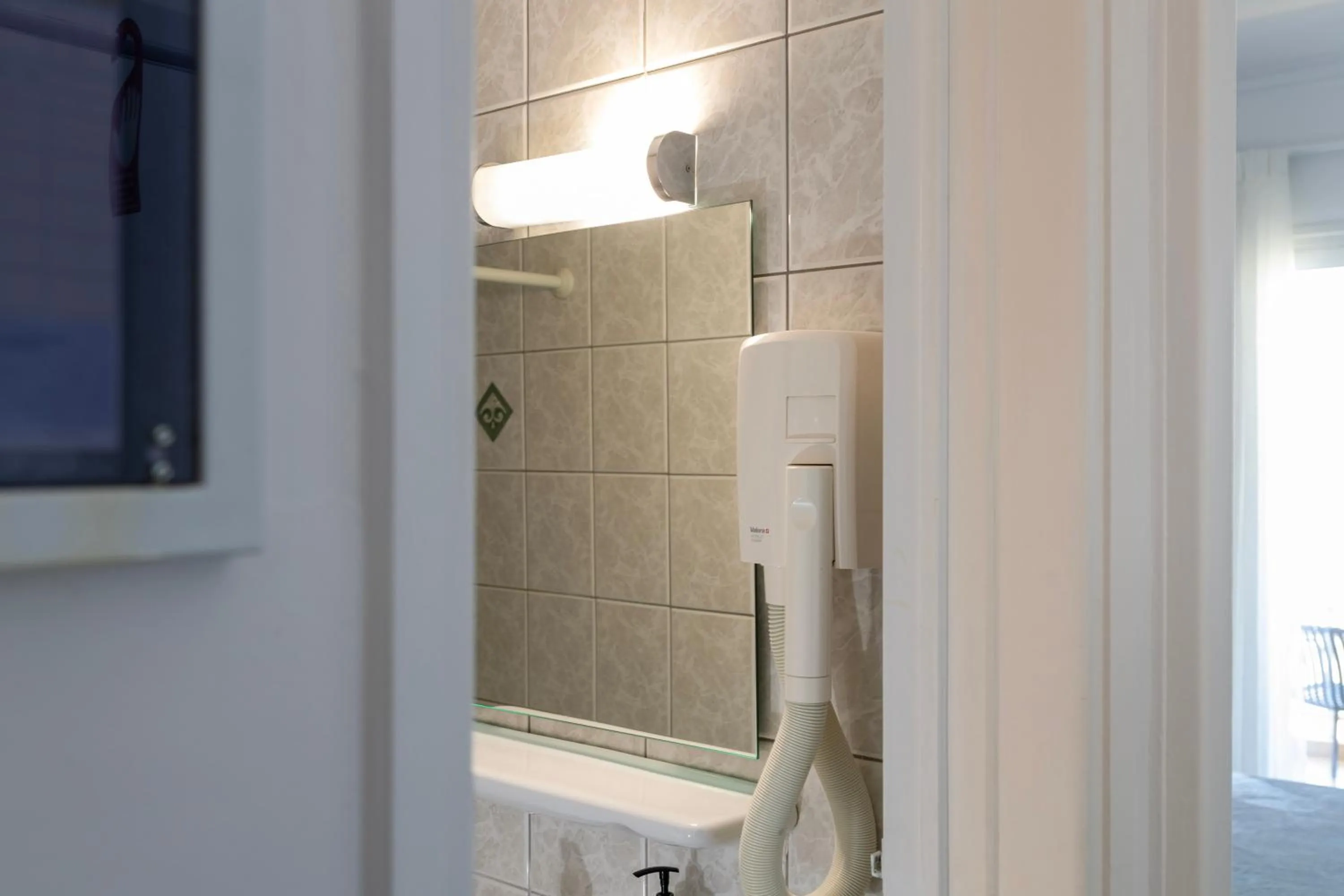 Bathroom in Delfini Hotel