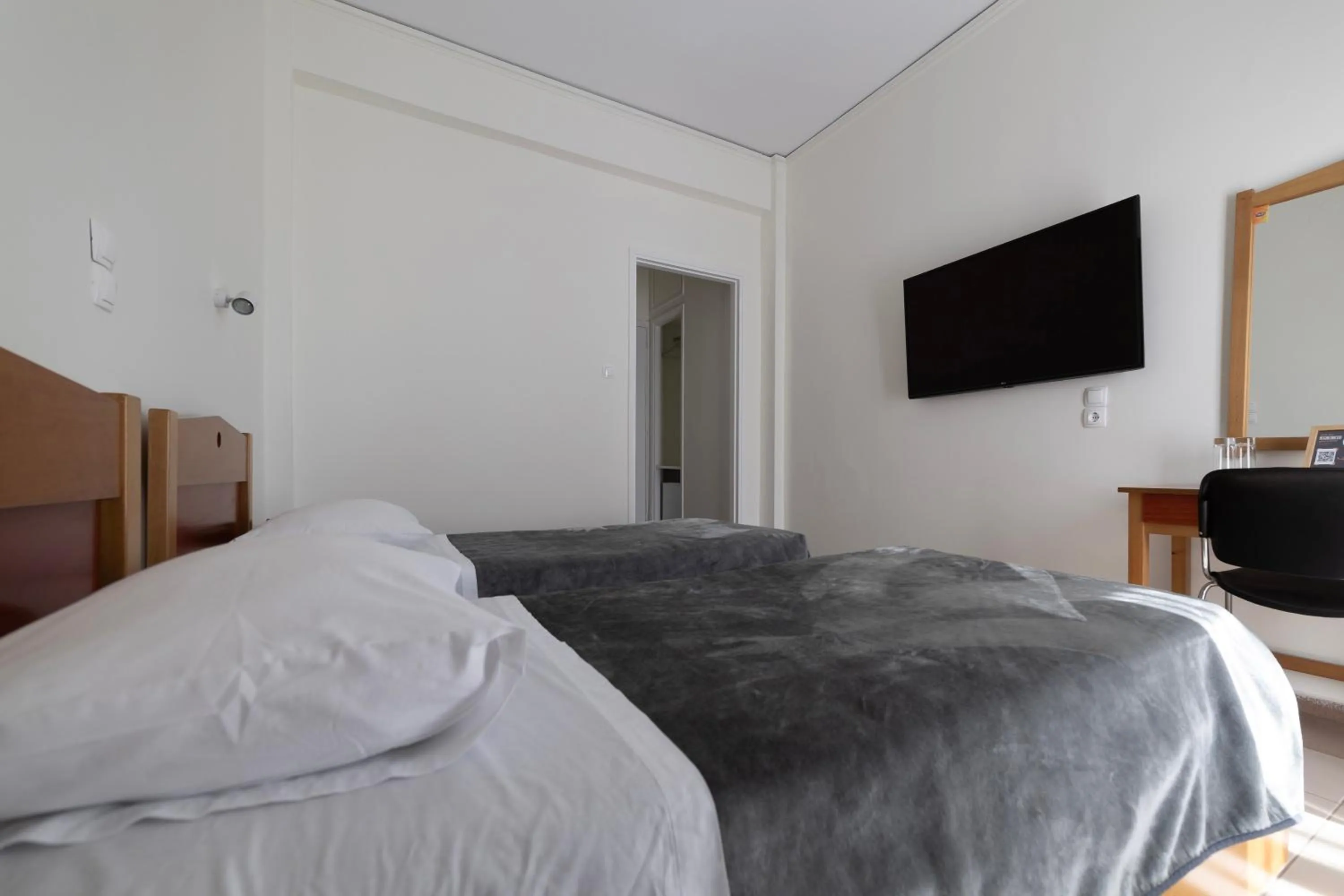 Bed in Delfini Hotel