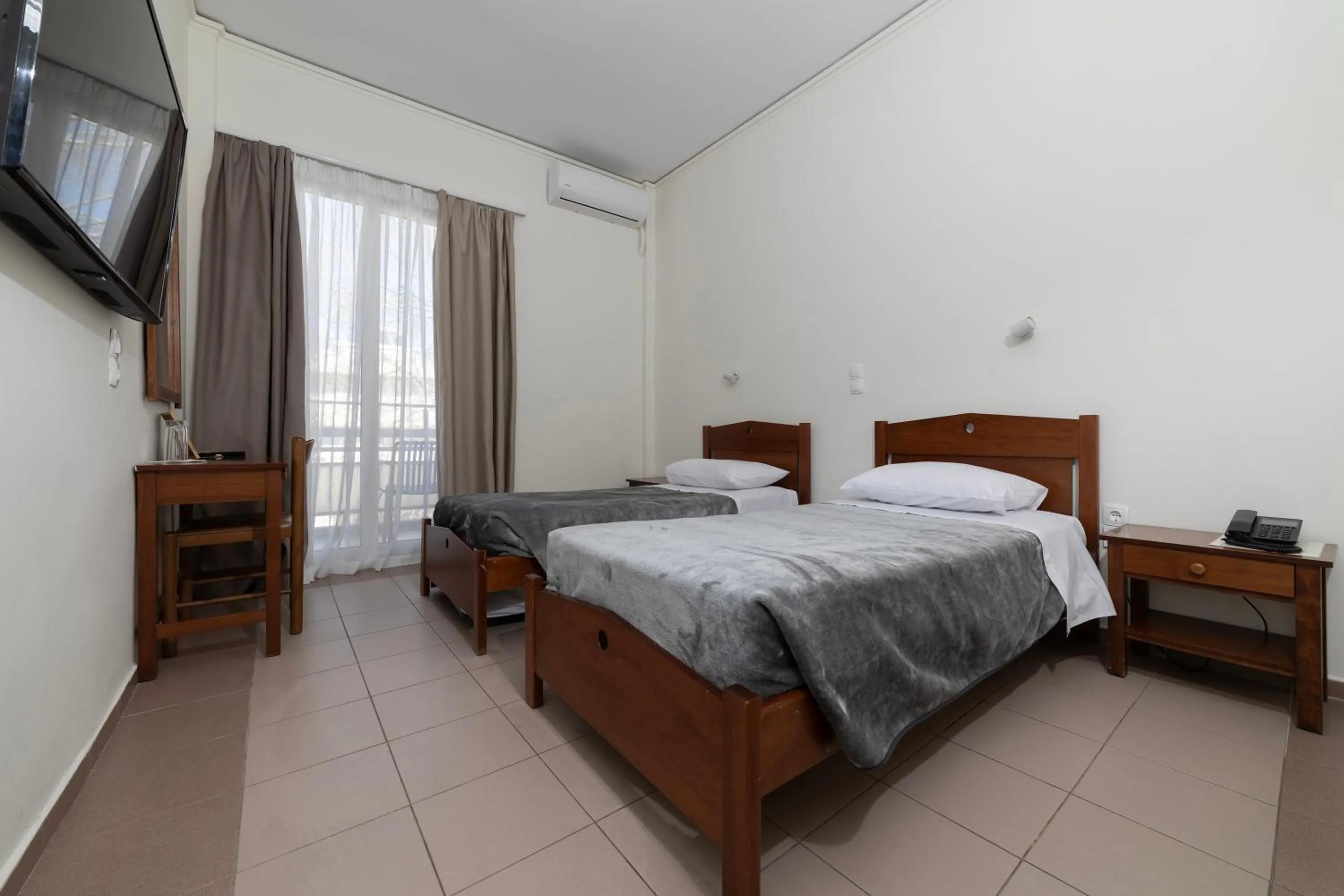 Bed in Delfini Hotel