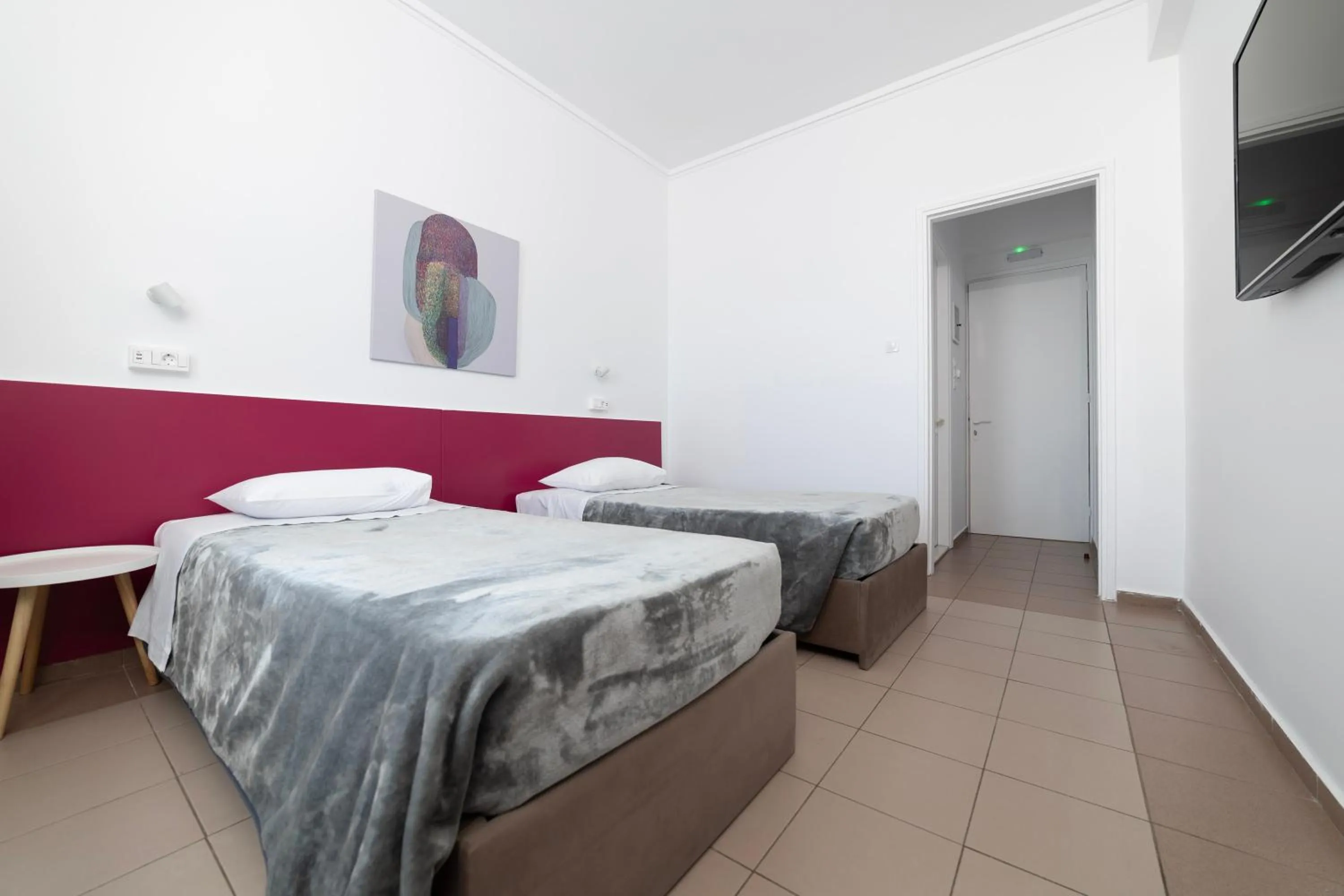 Bed in Delfini Hotel