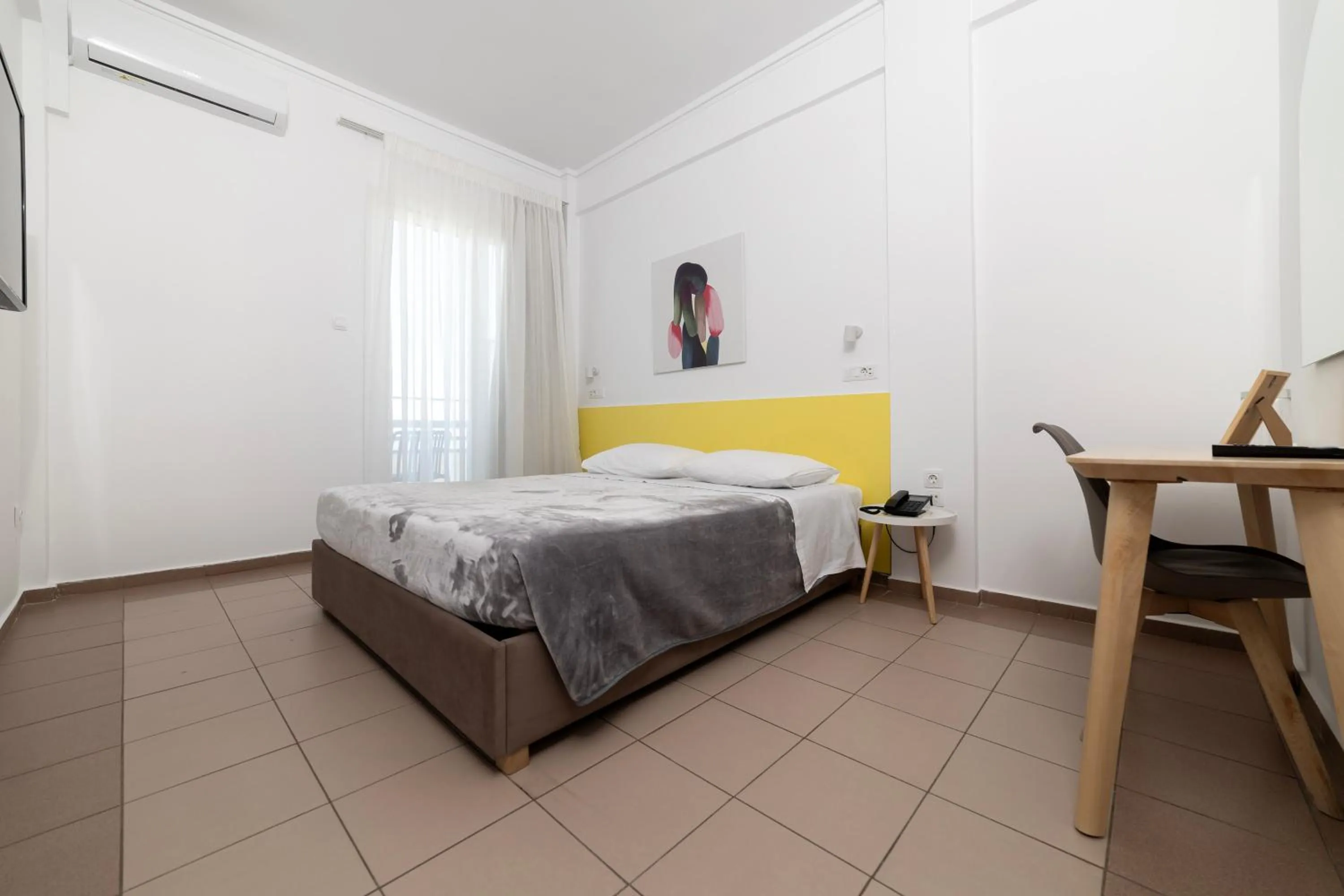 Bed in Delfini Hotel