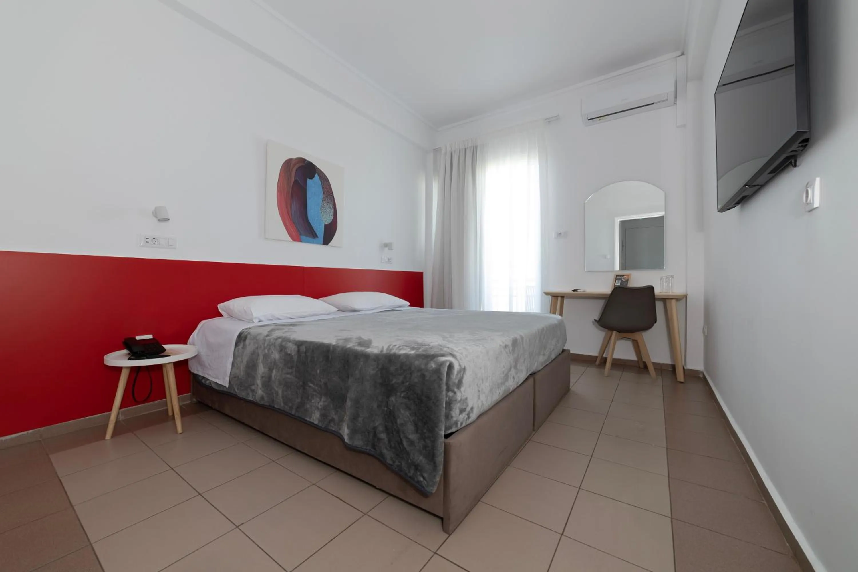 Bed in Delfini Hotel