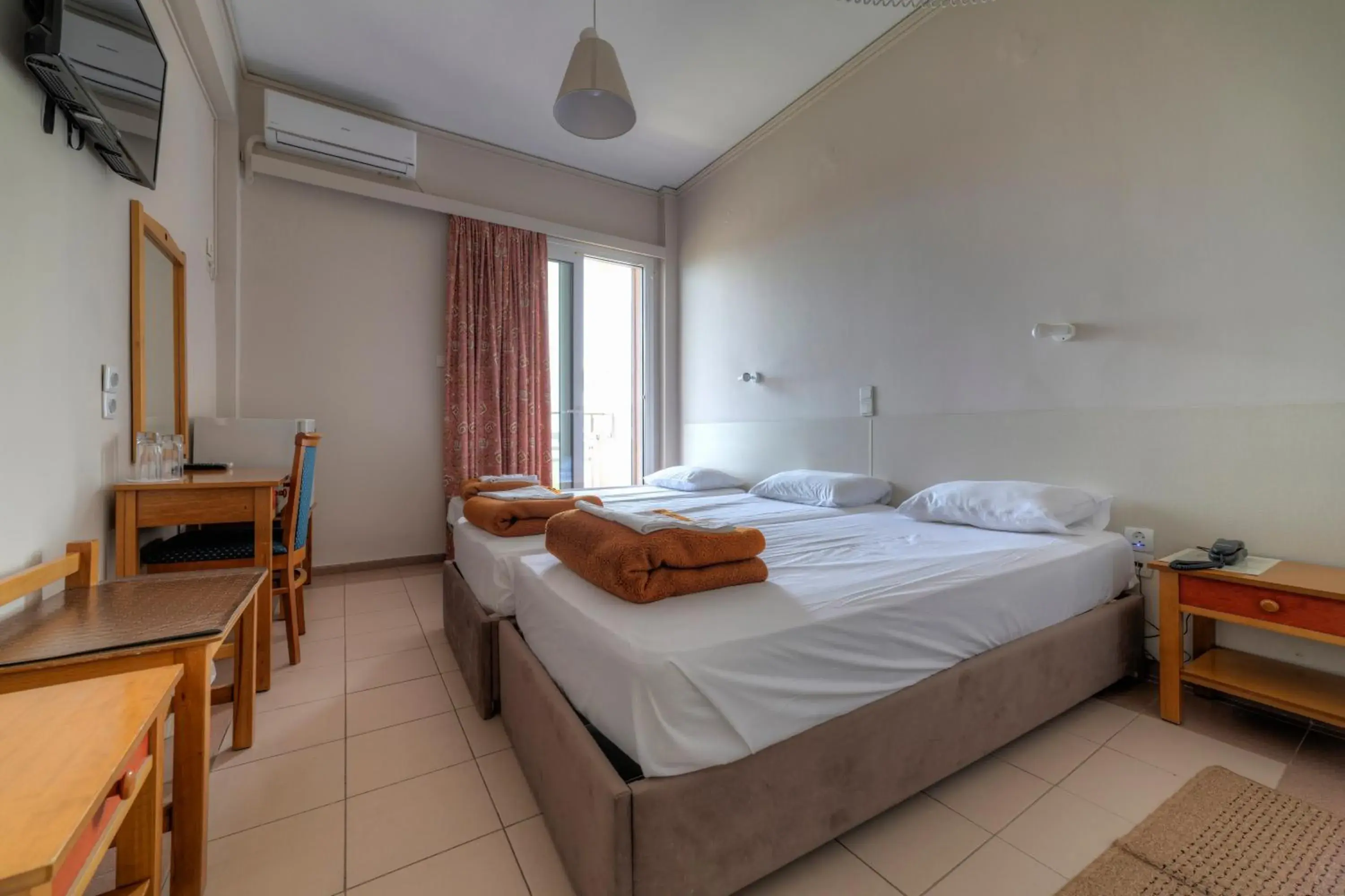 Bed in Delfini Hotel Bed in Delfini Hotel