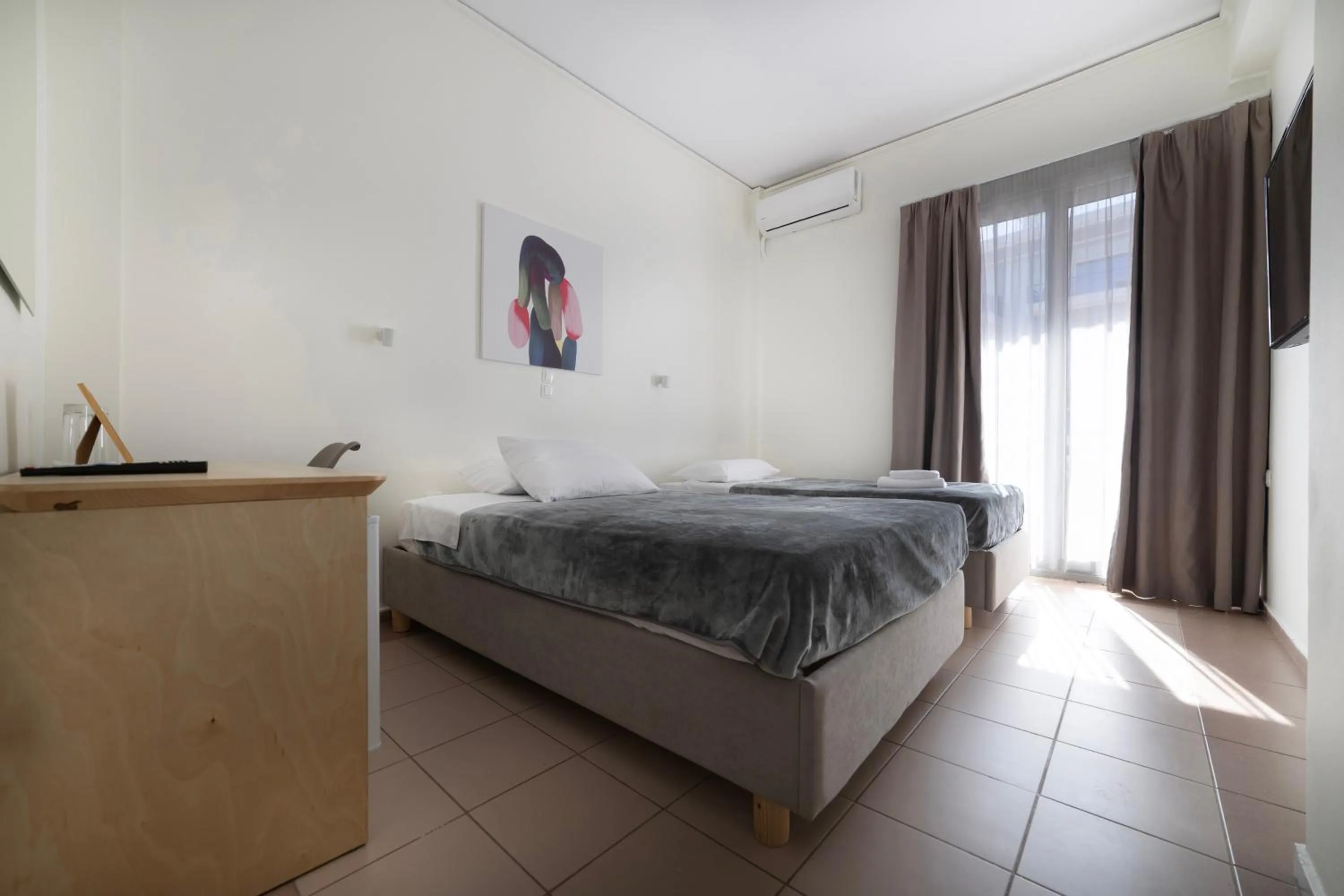 Bed in Delfini Hotel