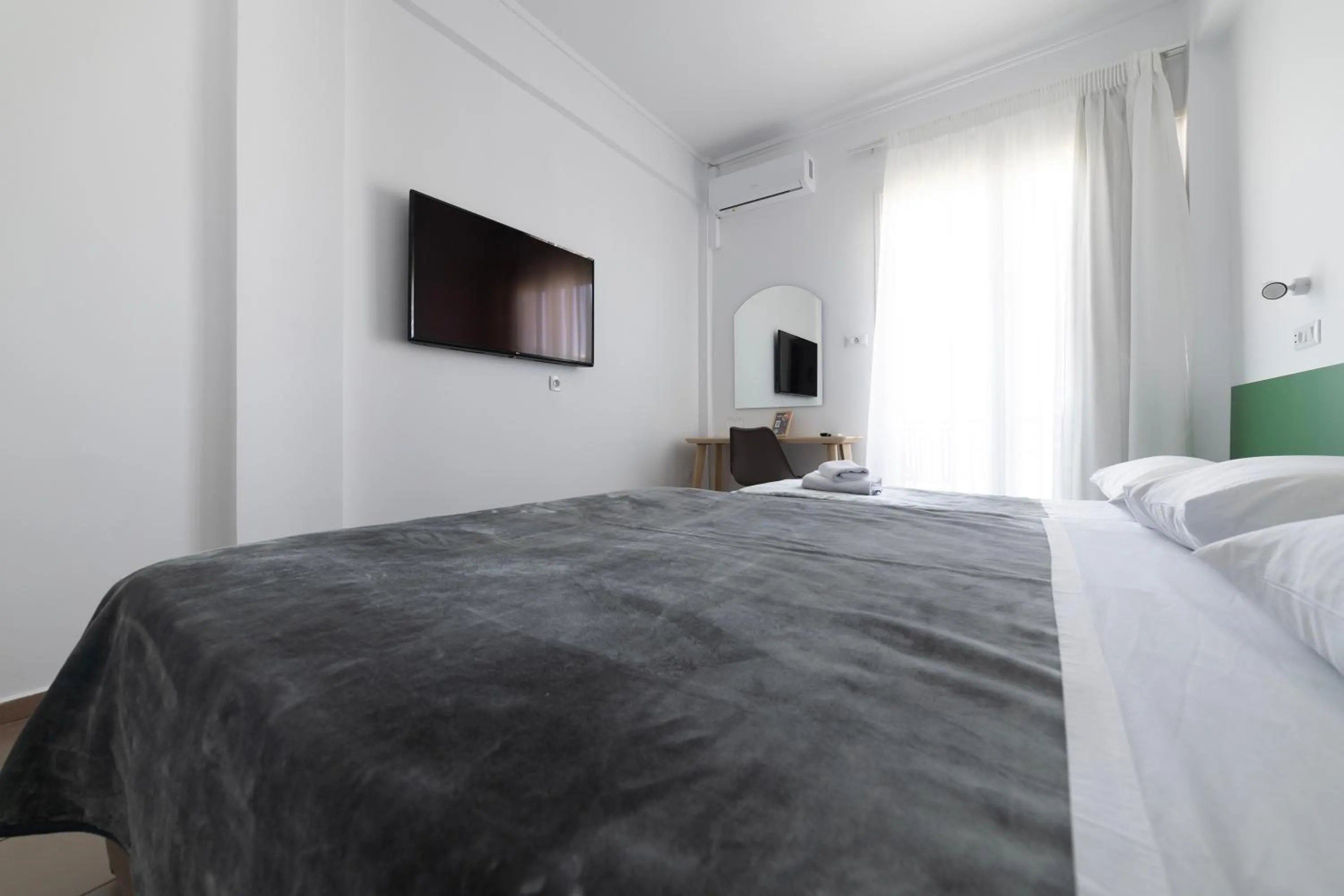 Bed in Delfini Hotel