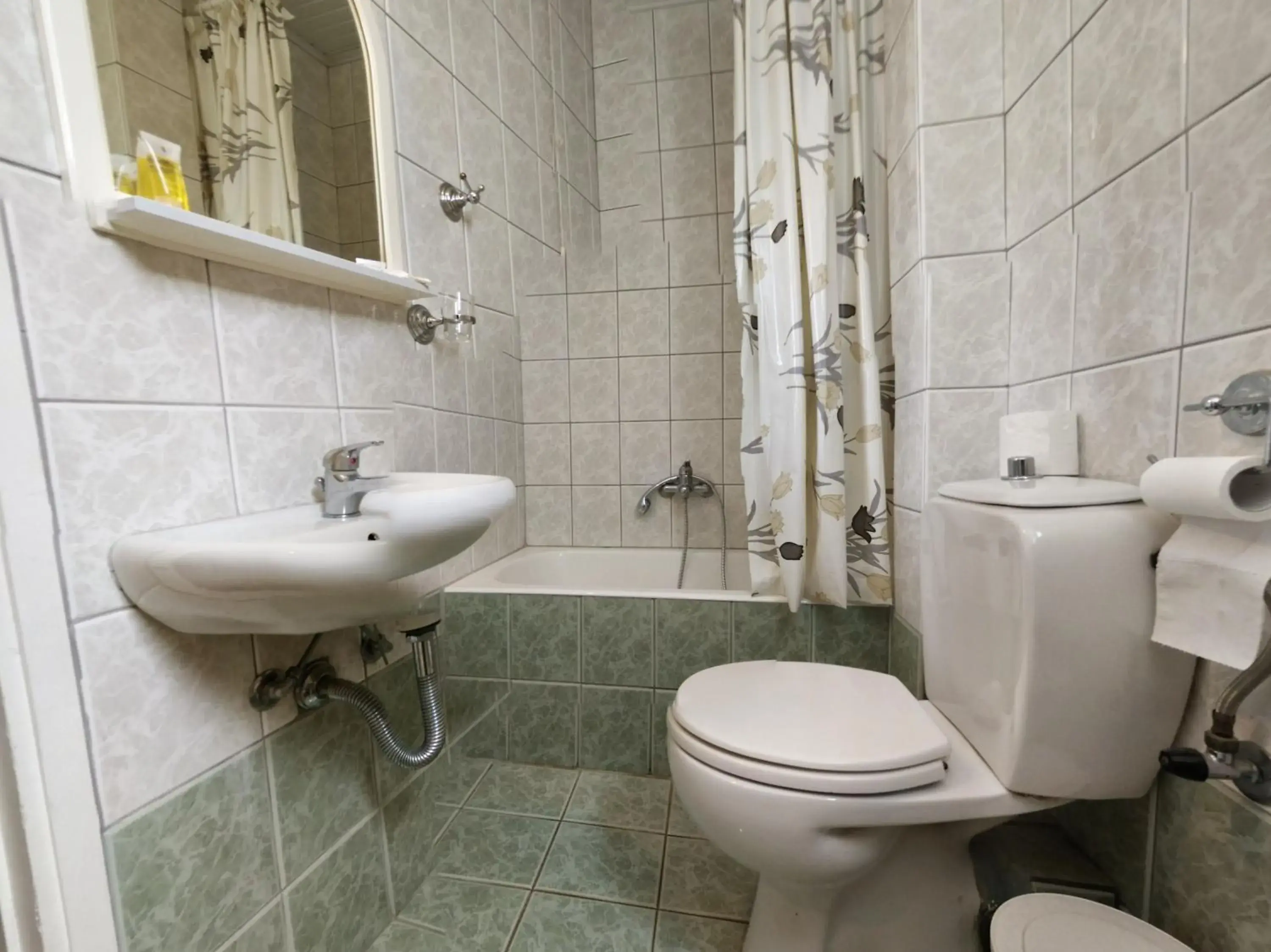 Bathroom in Delfini Hotel Bathroom in Delfini Hotel