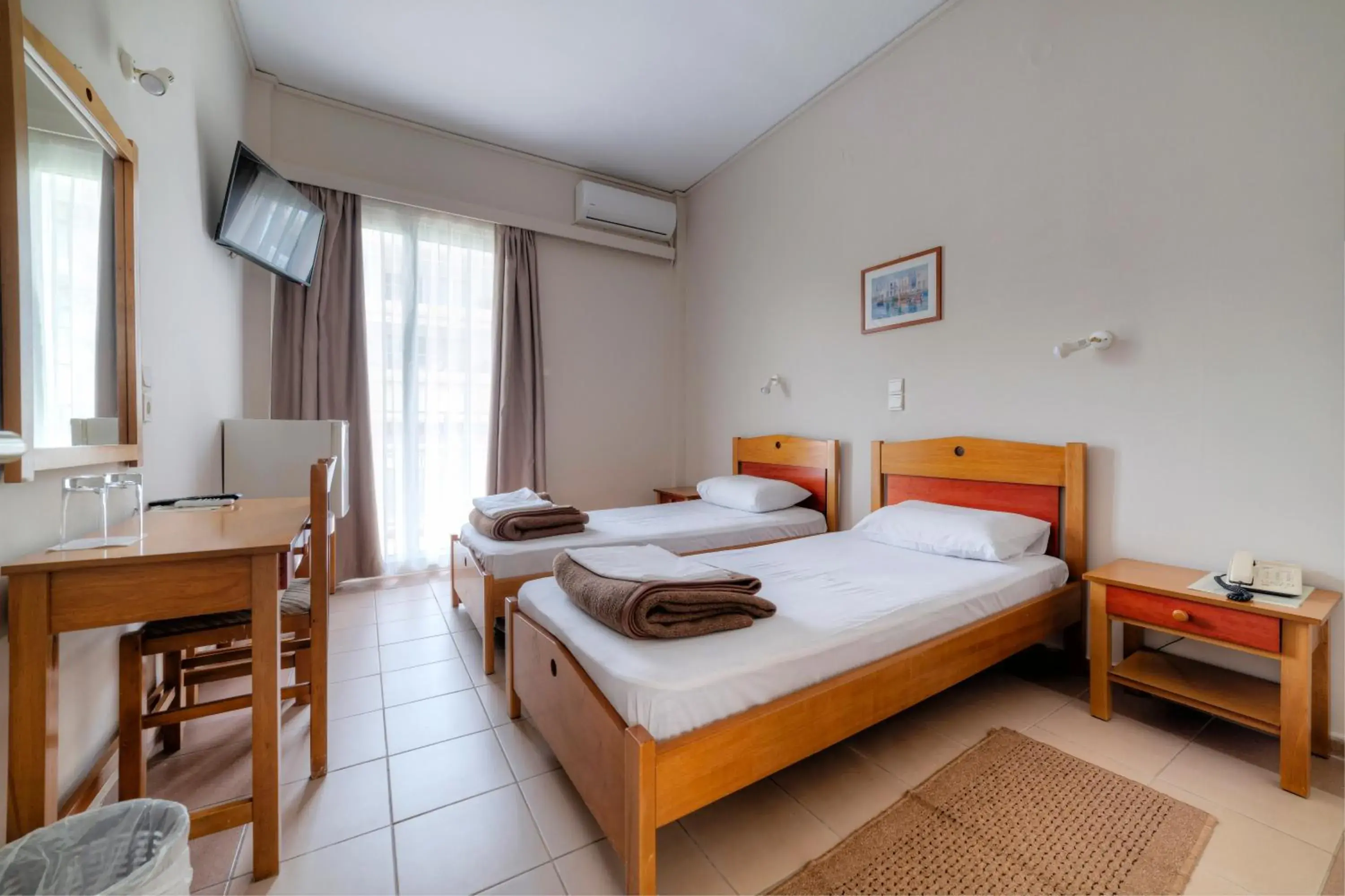 Bed in Delfini Hotel Bed in Delfini Hotel