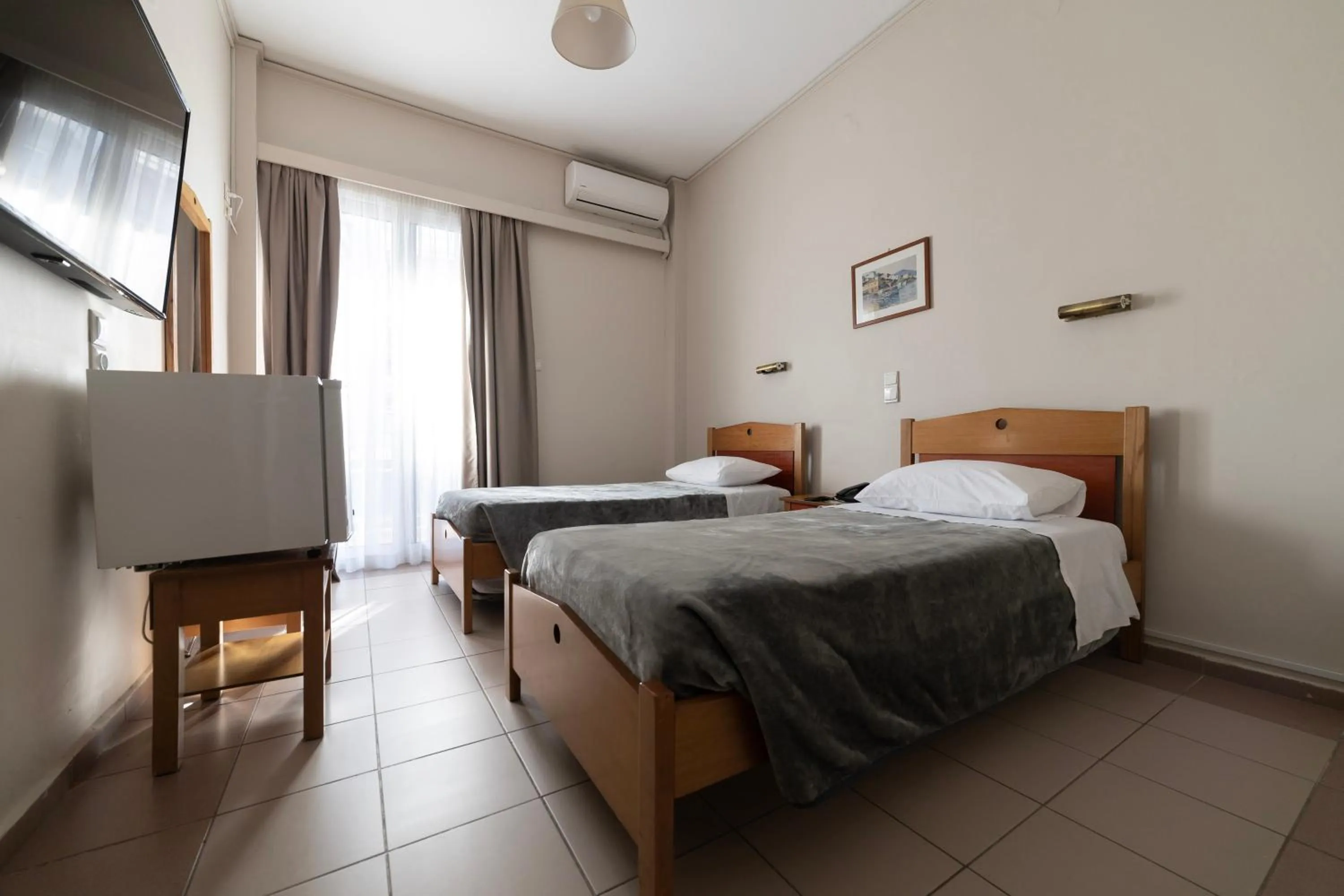 Bed in Delfini Hotel