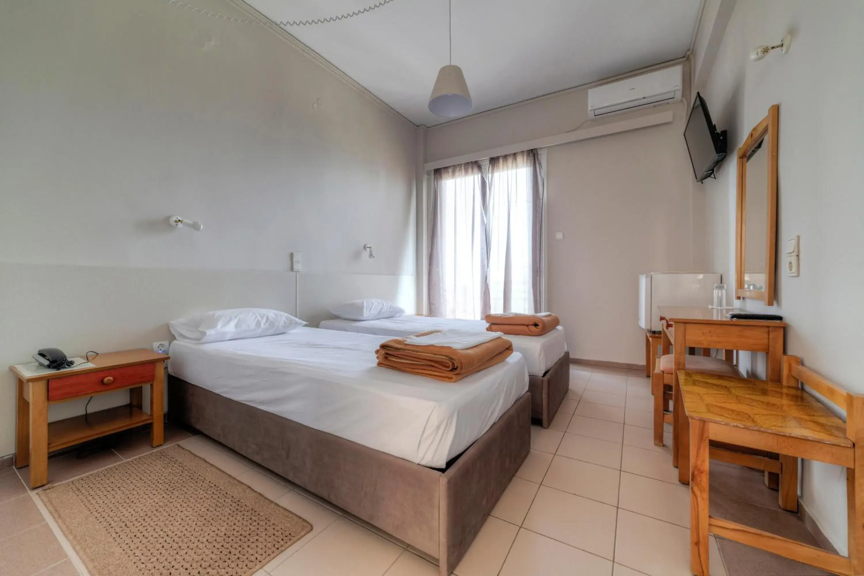 Bed in Delfini Hotel Bed in Delfini Hotel