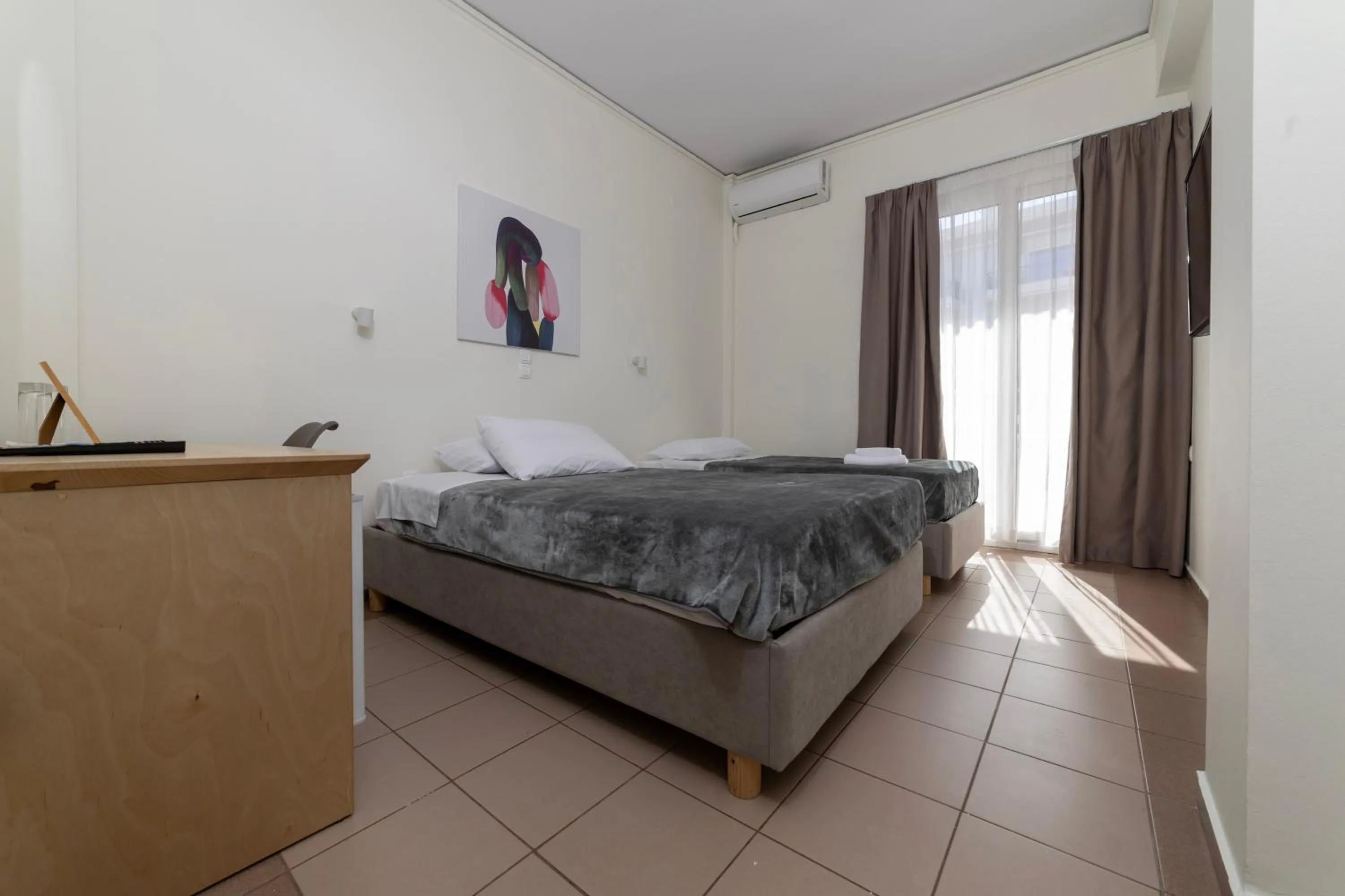 Bed in Delfini Hotel