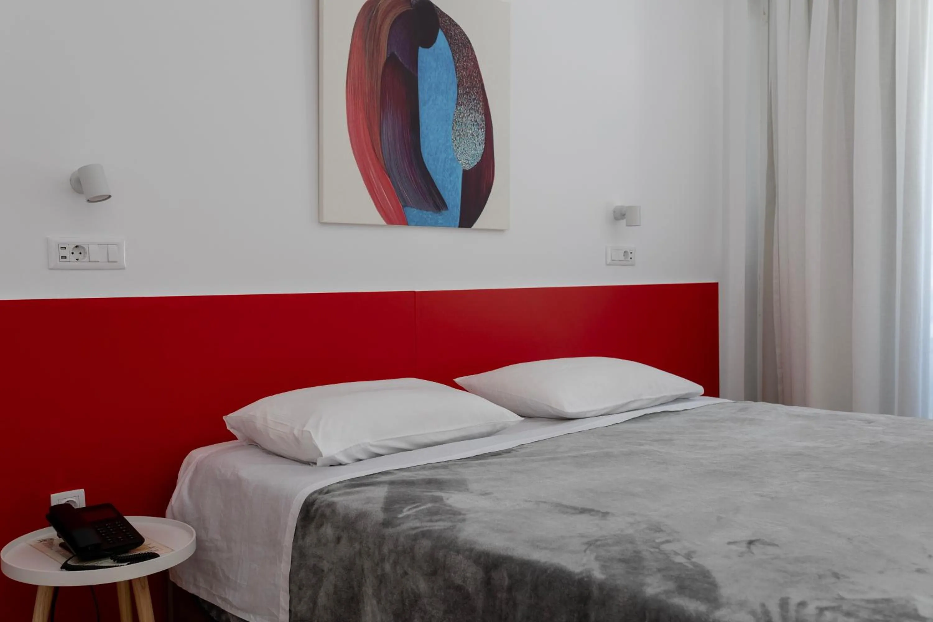 Bed in Delfini Hotel