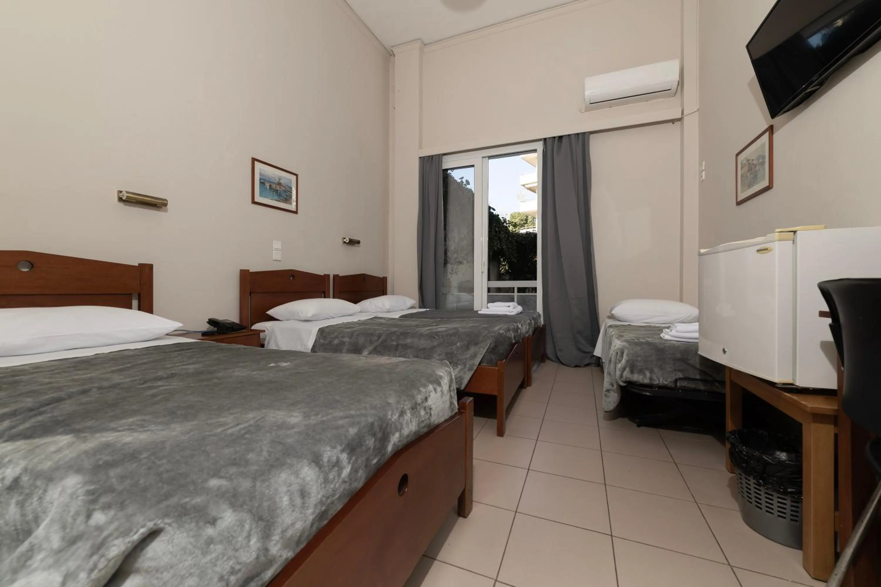 Bed in Delfini Hotel