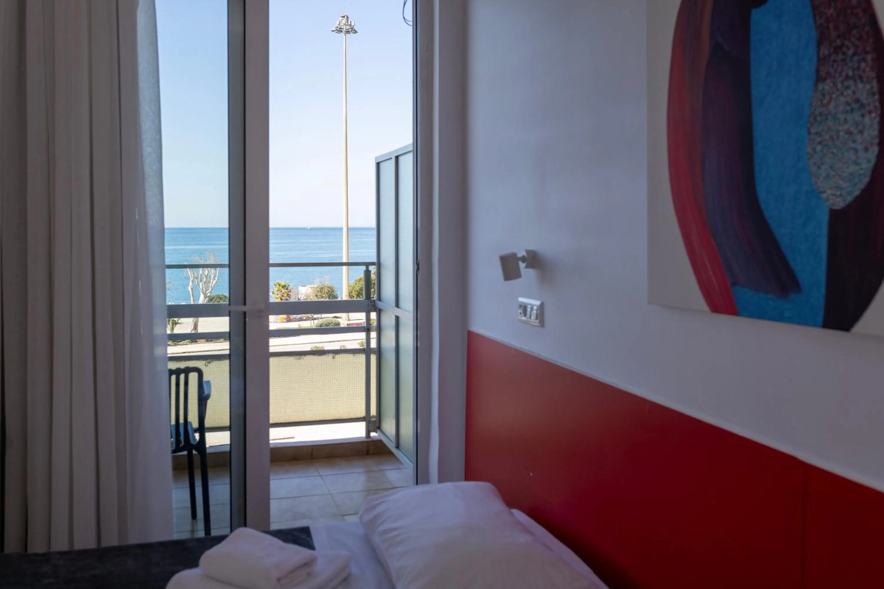 Bed in Delfini Hotel