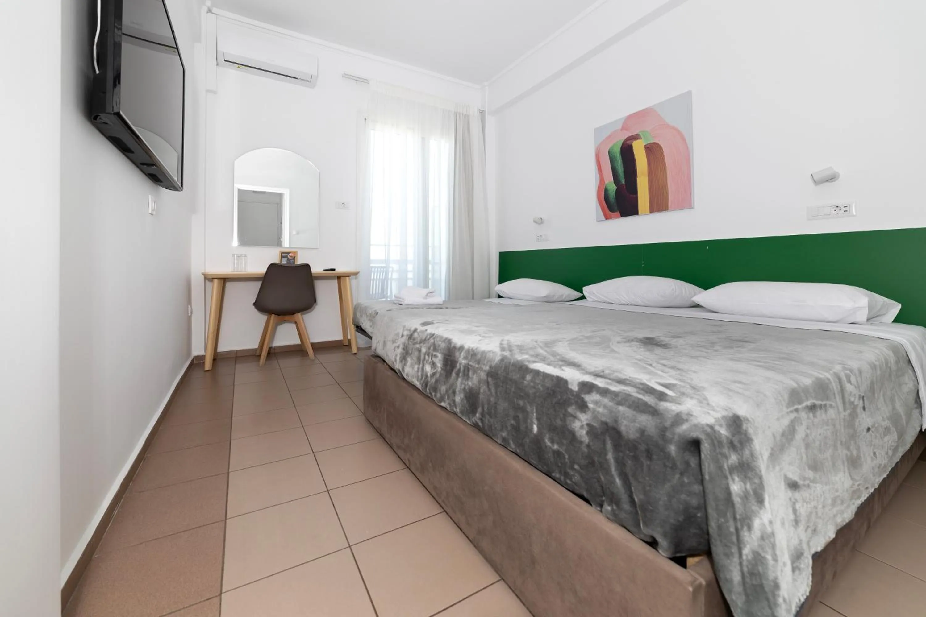 Bed in Delfini Hotel