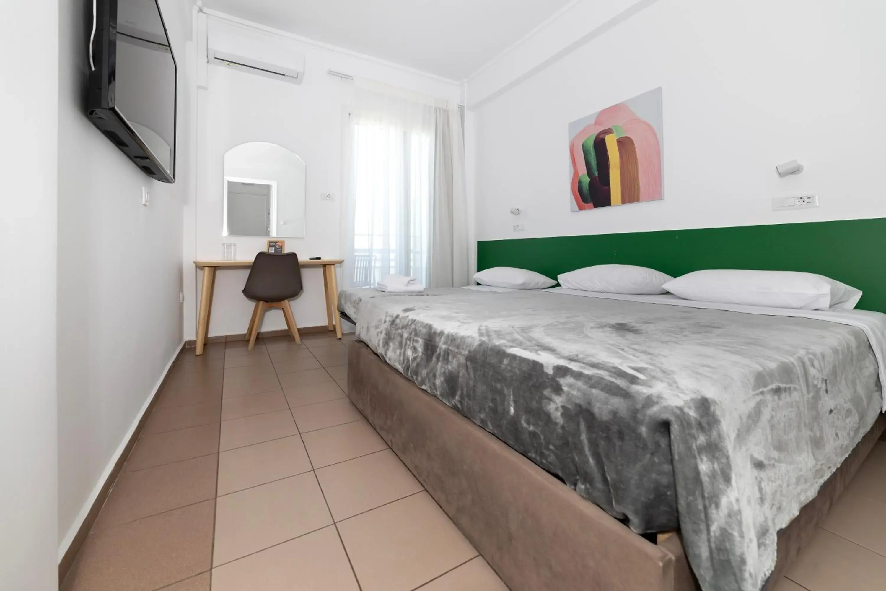 Bed in Delfini Hotel Bed in Delfini Hotel