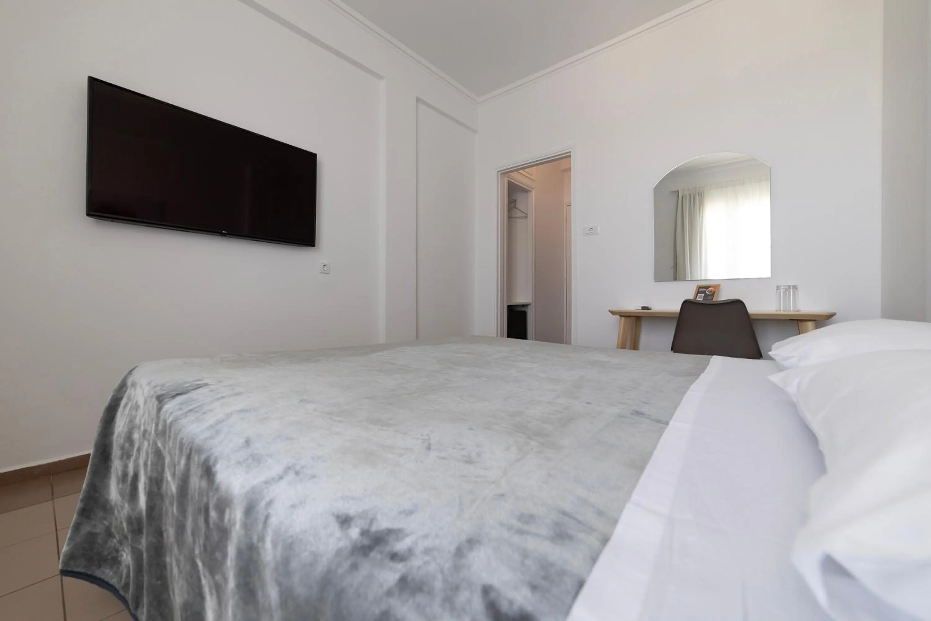 Bed in Delfini Hotel