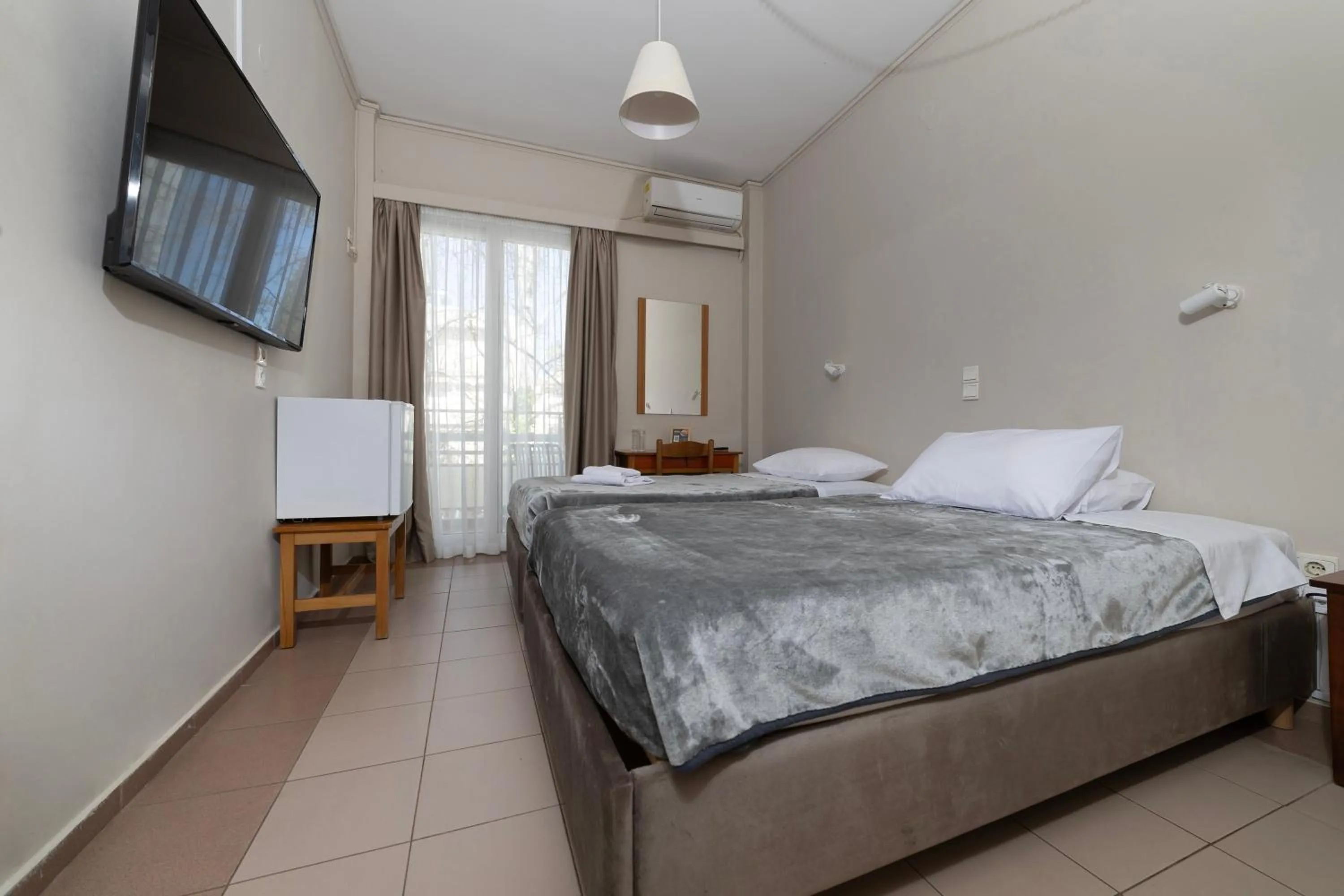 Bed in Delfini Hotel