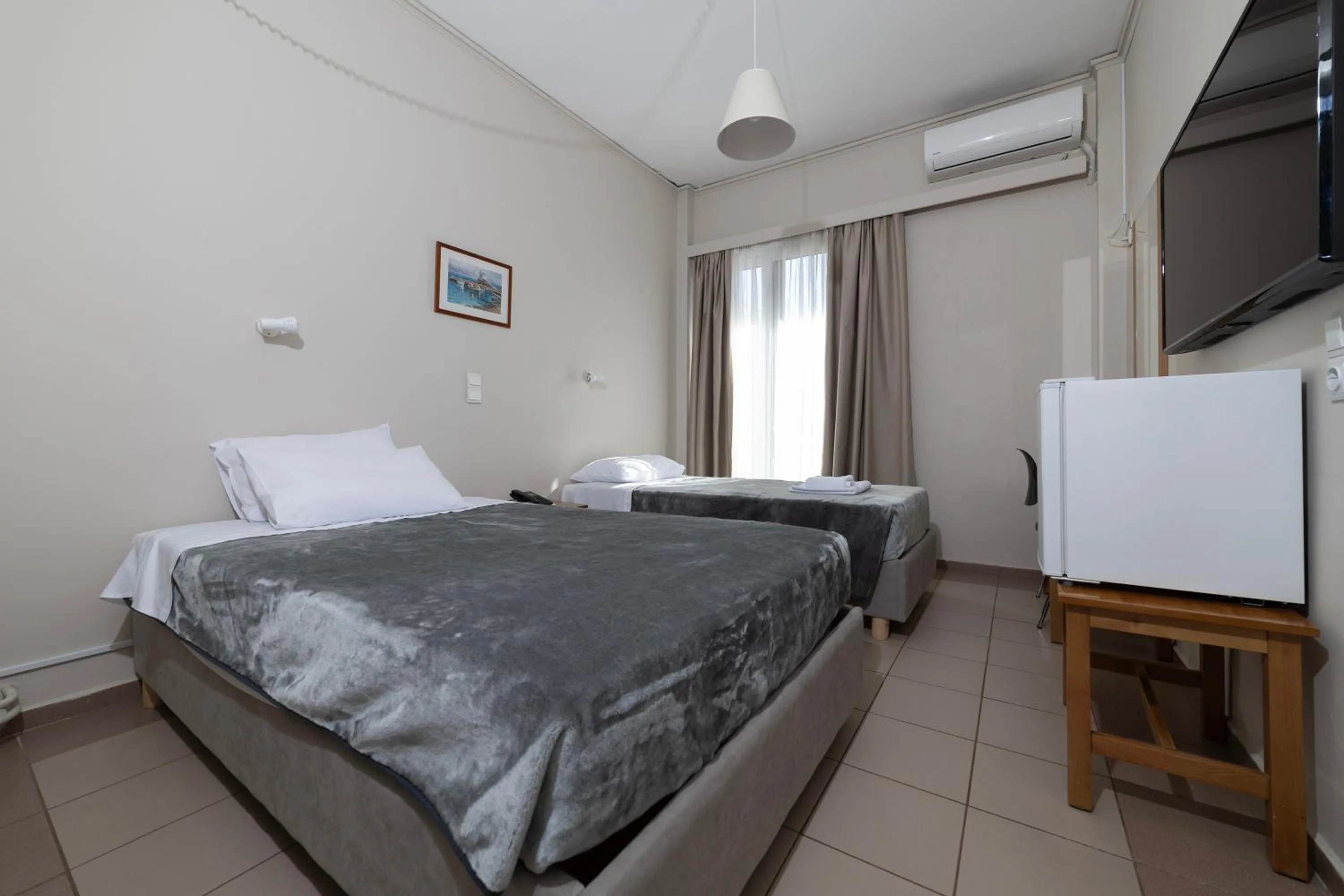 Bed in Delfini Hotel