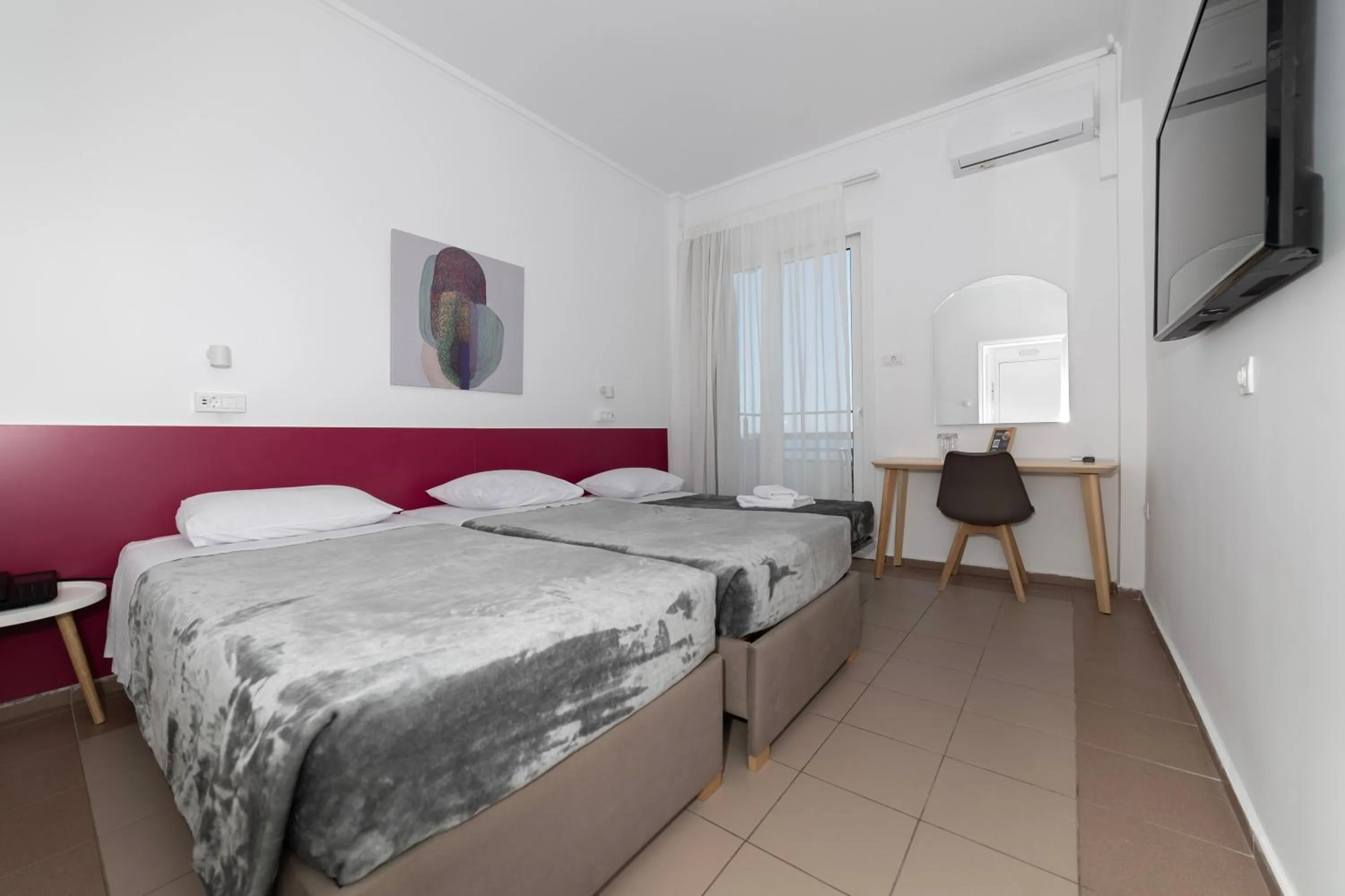 Bed in Delfini Hotel