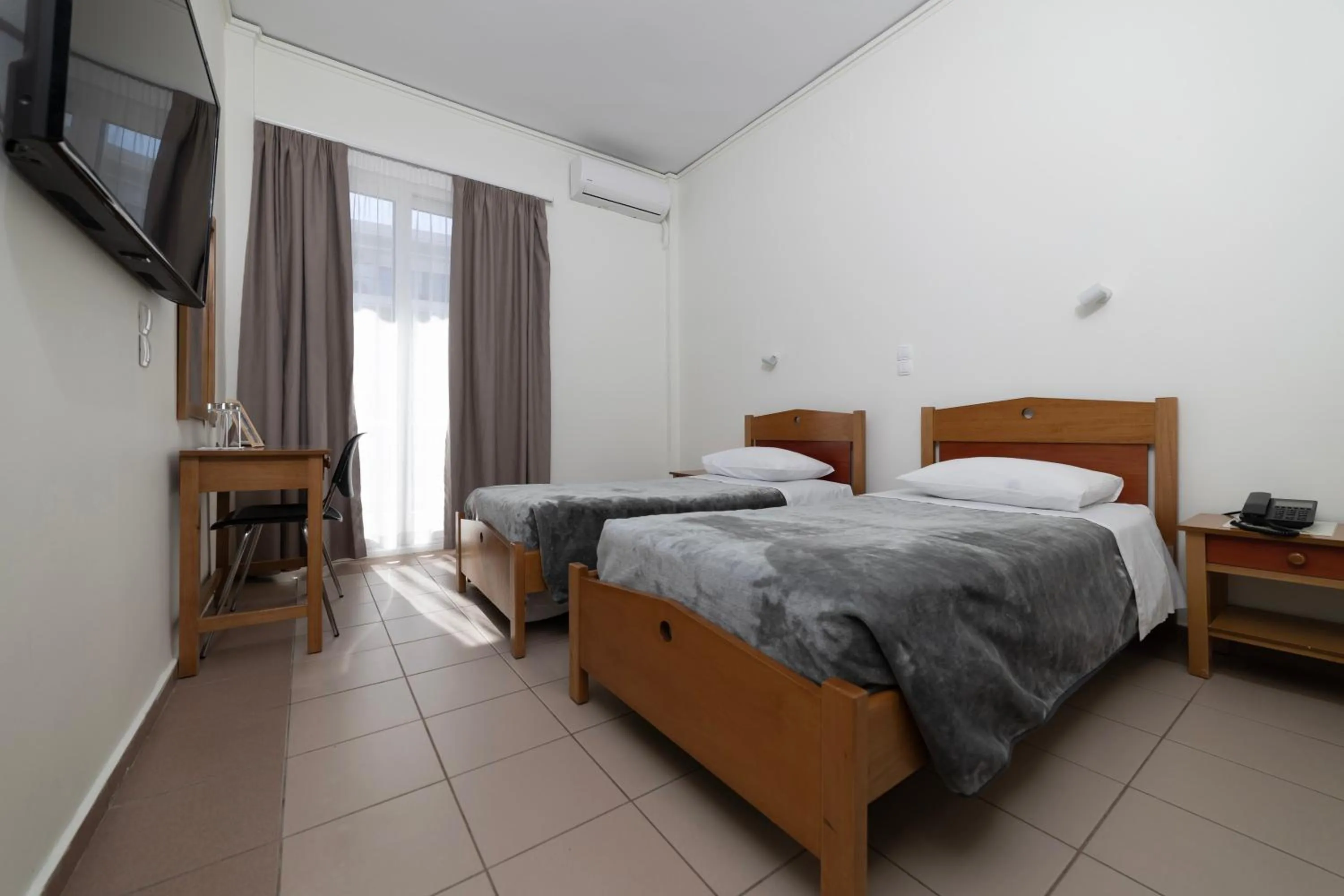 Bed in Delfini Hotel