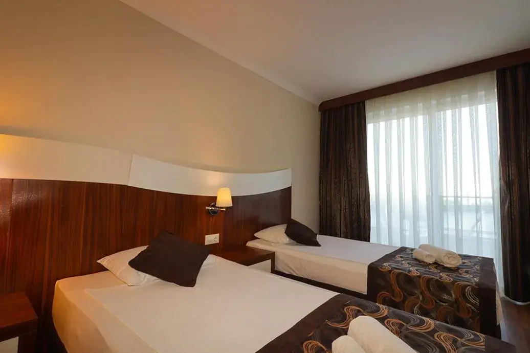 Bedroom, Bed in Throne Beach Resort & Spa - Ultra All Inclusive Bedroom, Bed in Throne Beach Resort & Spa - Ultra All Inclusive