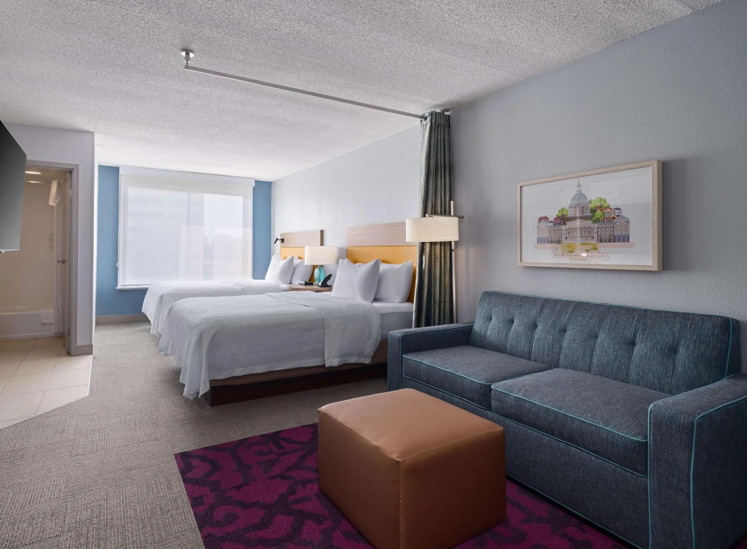 Living room, Bed in Home2 Suites by Hilton Indianapolis - Keystone Crossing