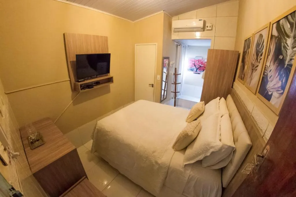 Bed in Pousada da Leide