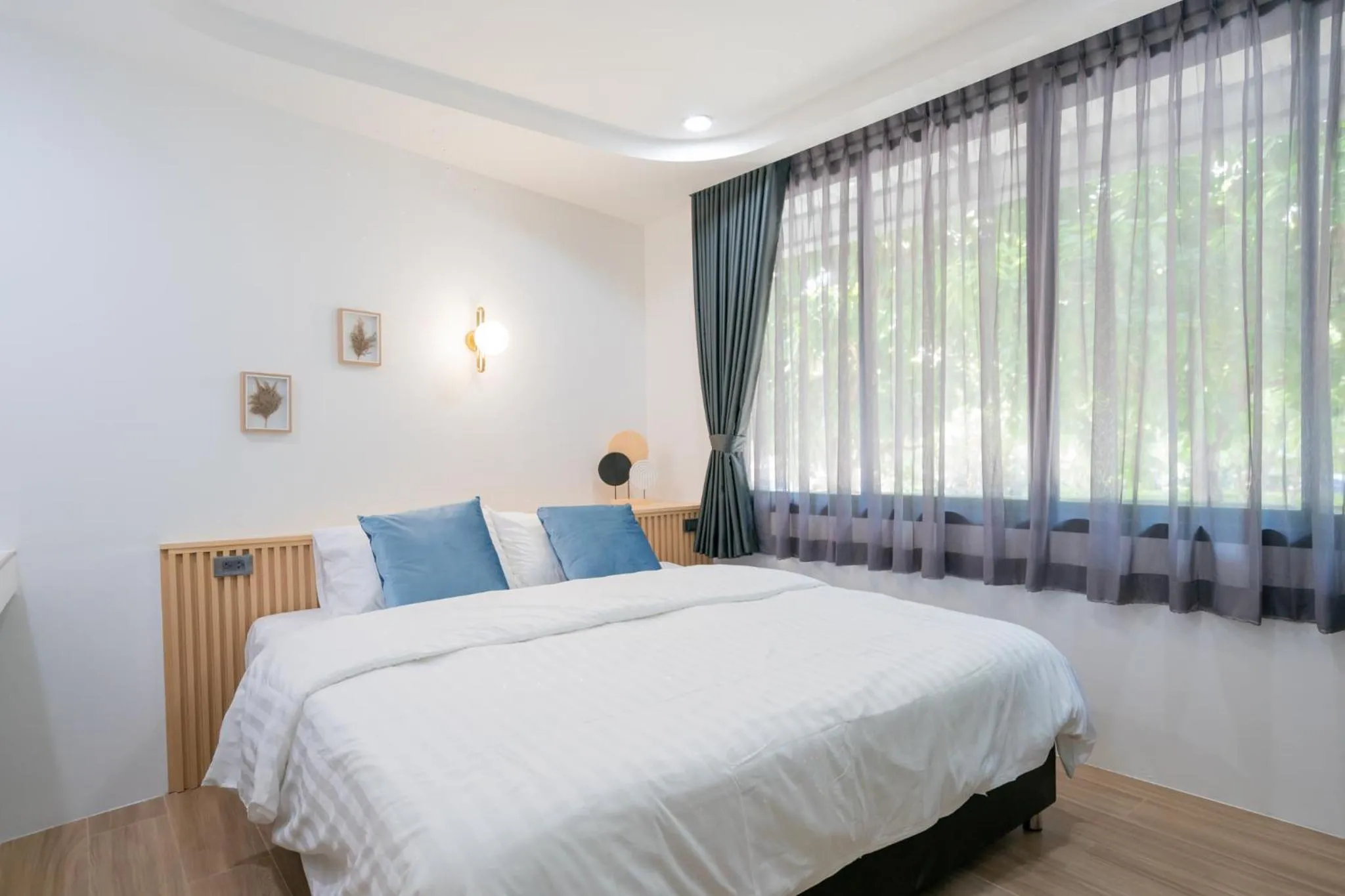 Bed in Phunaya Phuket Oldtown Hotel