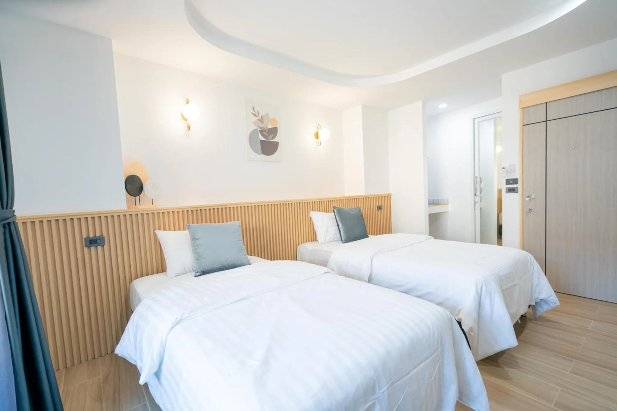Bed in Phunaya Phuket Oldtown Hotel