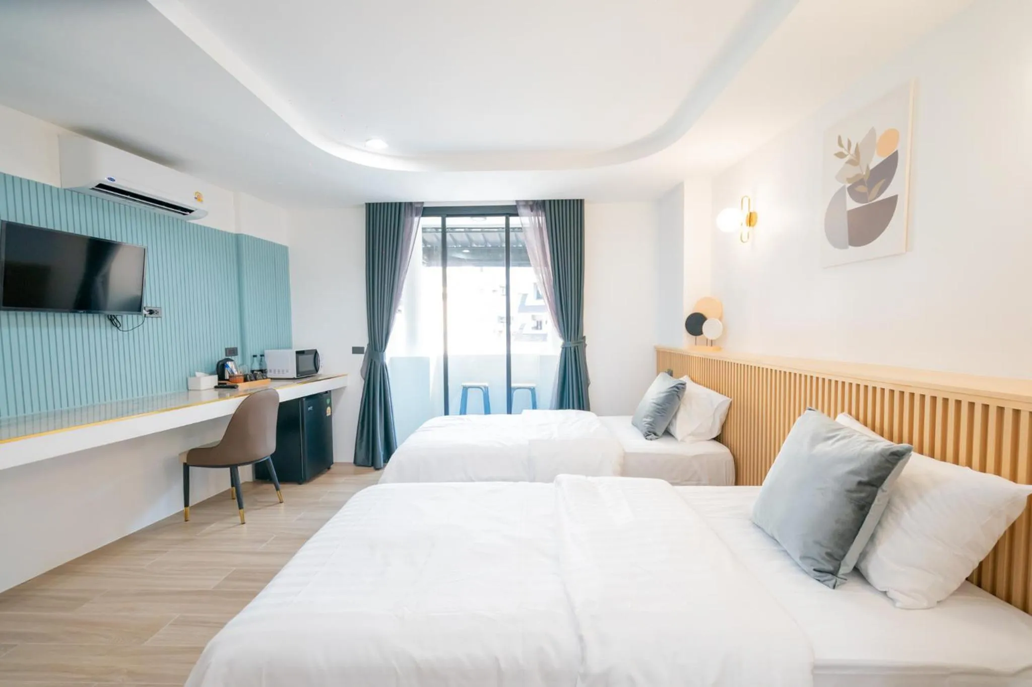 Bed in Phunaya Phuket Oldtown Hotel
