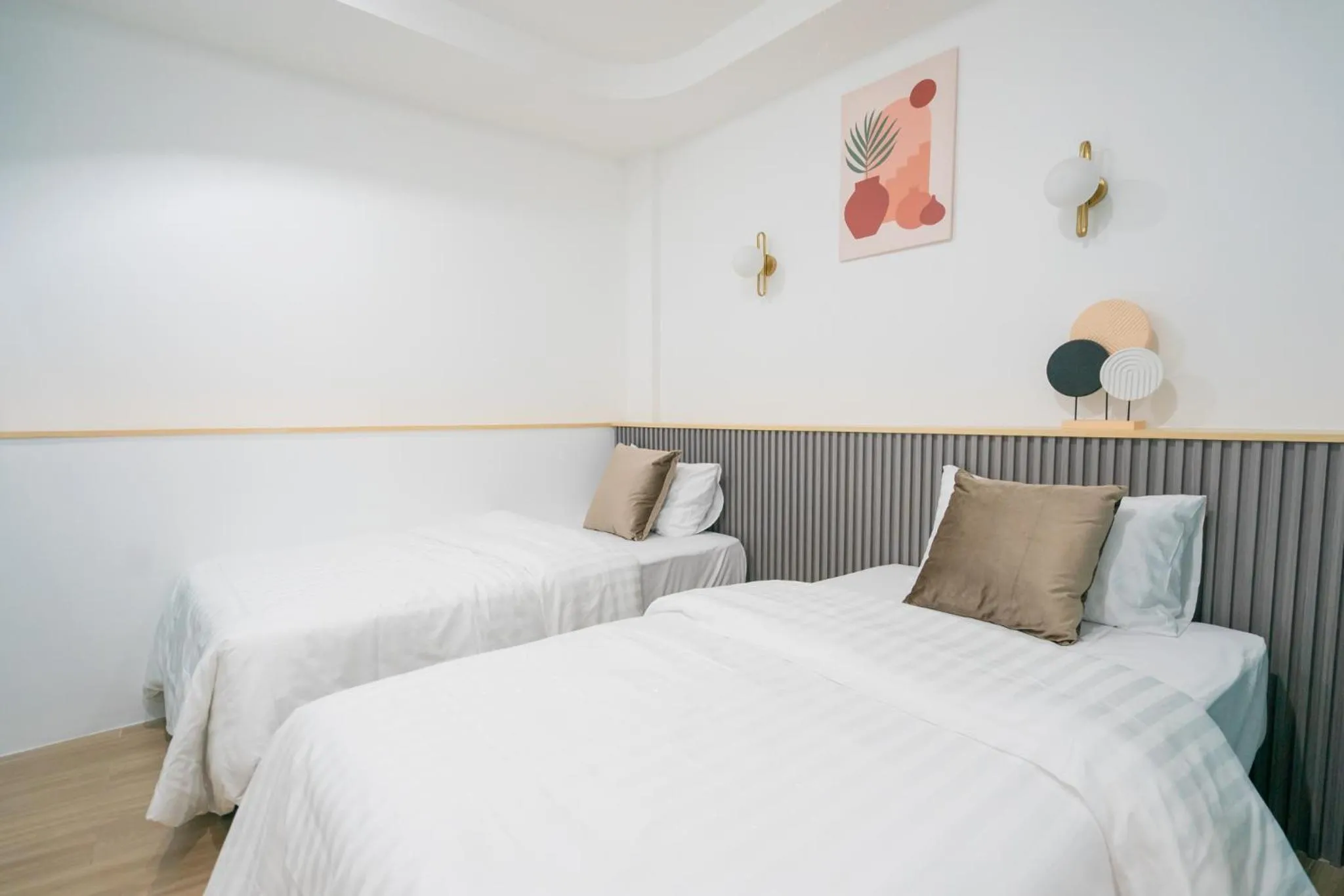 Bed in Phunaya Phuket Oldtown Hotel