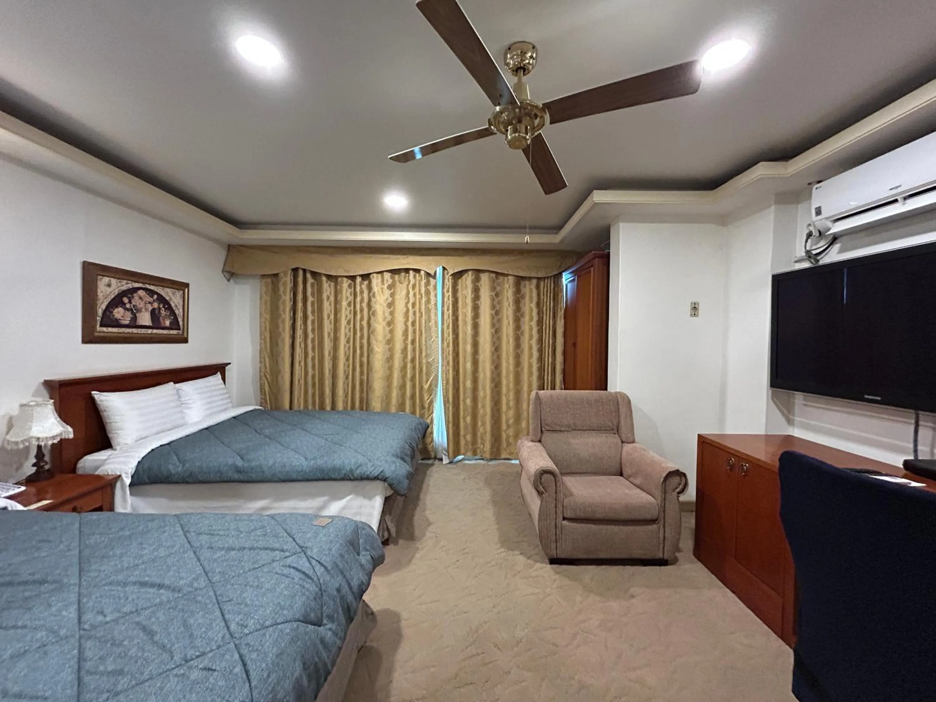 Bed in Asia Tourist Hotel