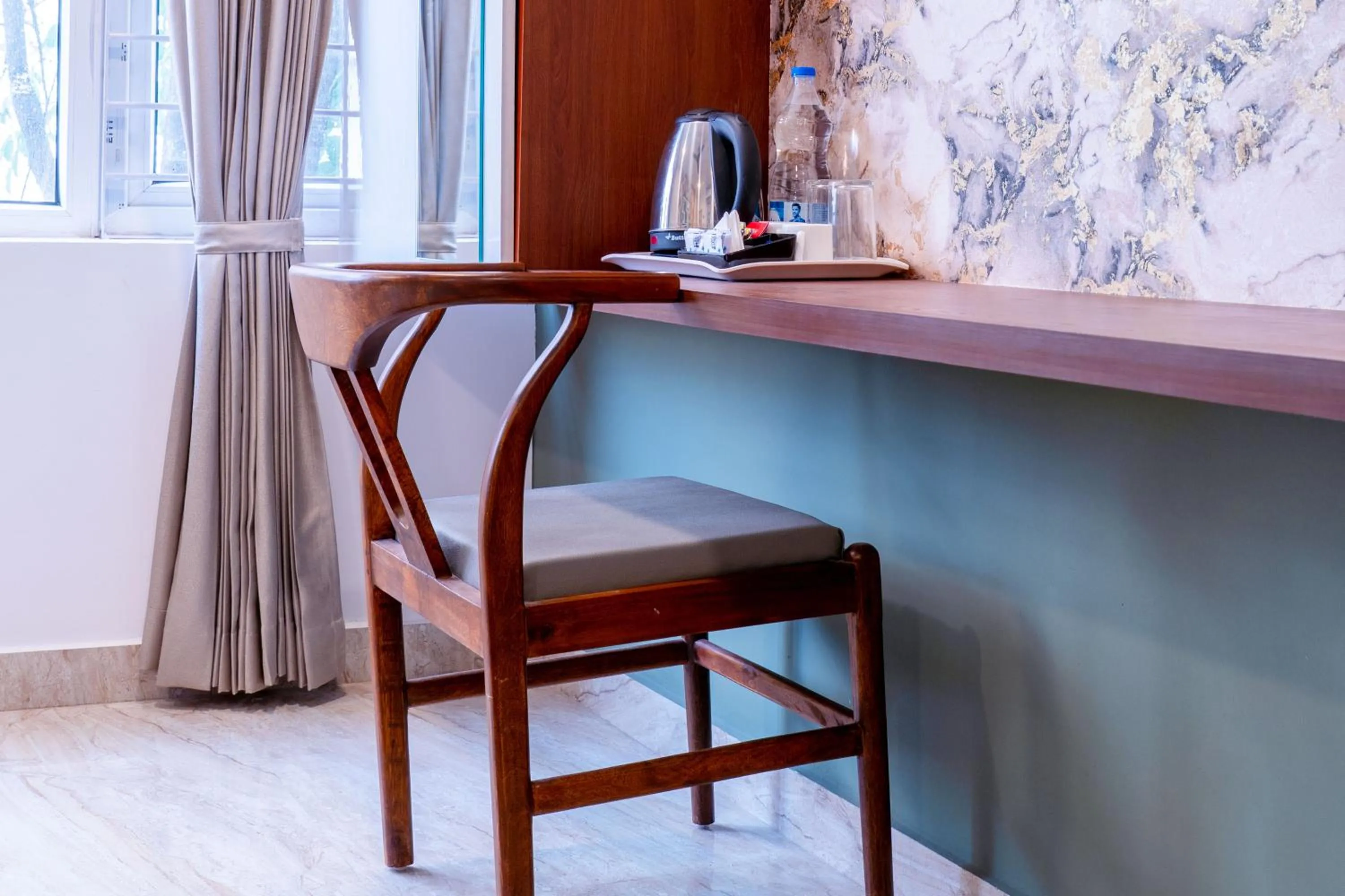 Bedroom in Treebo Emirates Suites Indiranagar