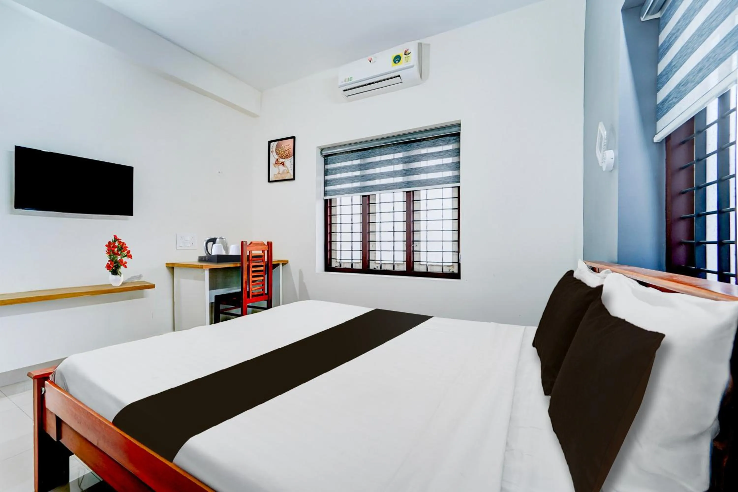 Bedroom, Bed in Super Hotel O Kazhakootam Near Technopark Phase 2
