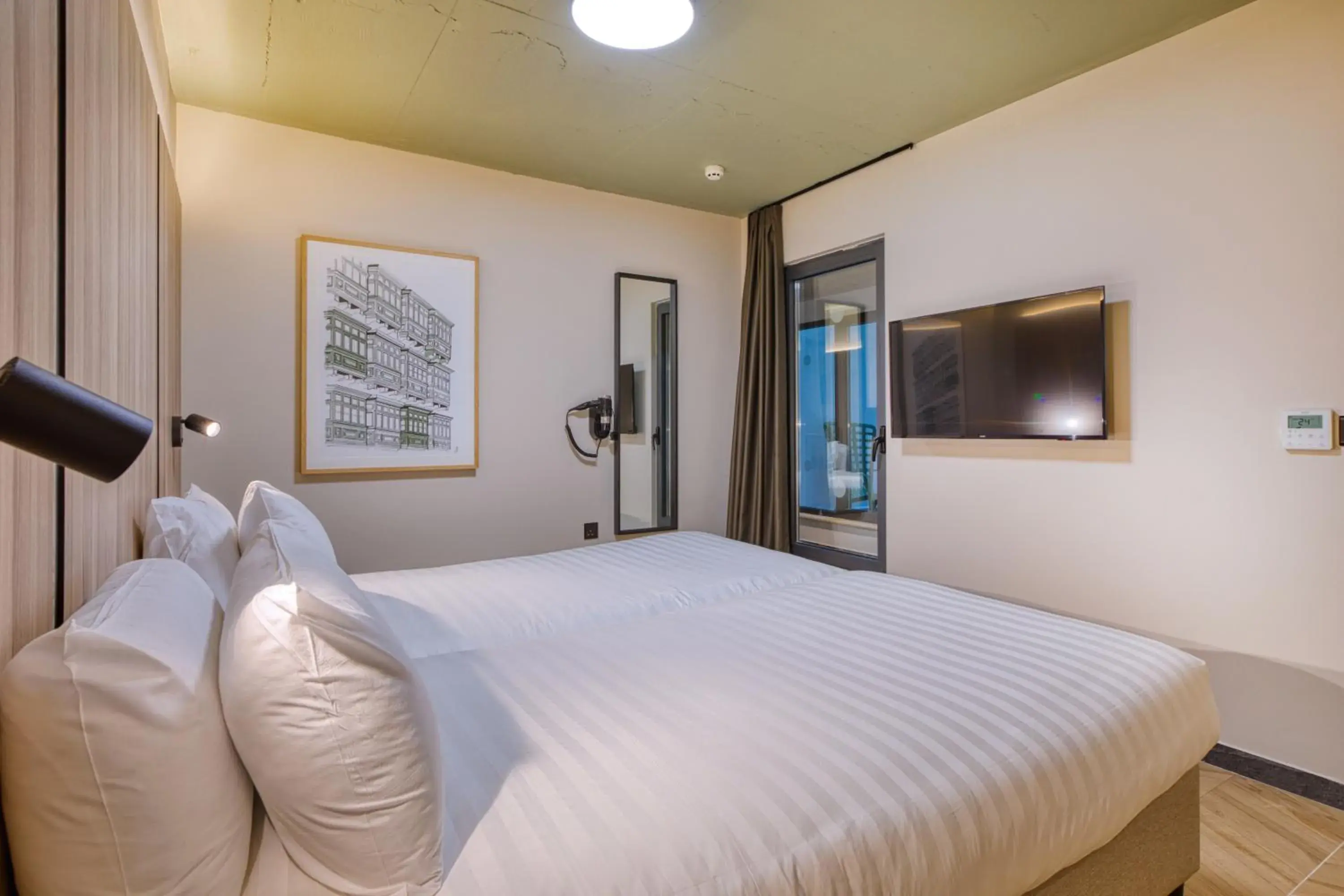 Bed in VITA Hotel & Rooftop Bed in VITA Hotel & Rooftop