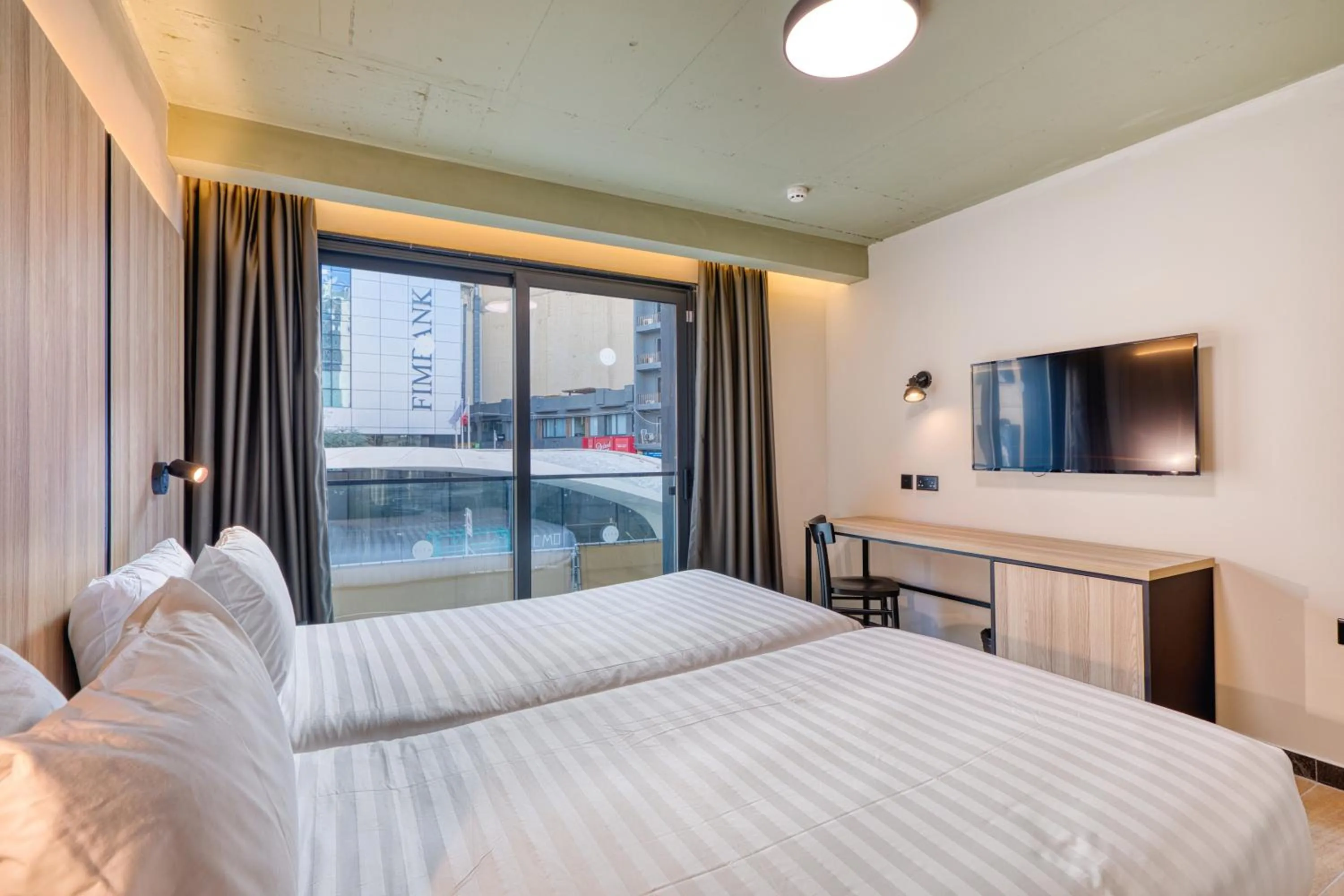 Bed in VITA Hotel & Rooftop