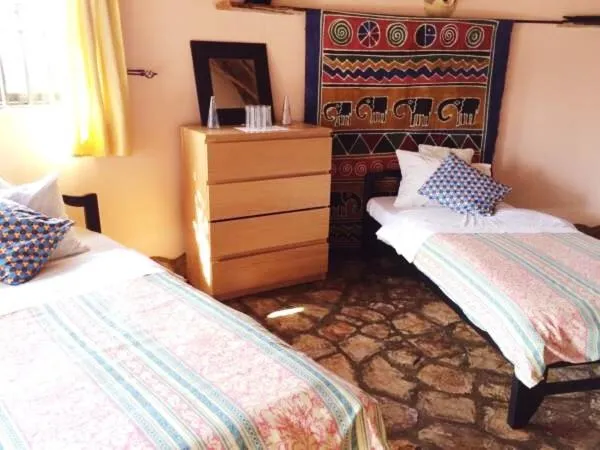 Bed in Nyore Hillside Retreat