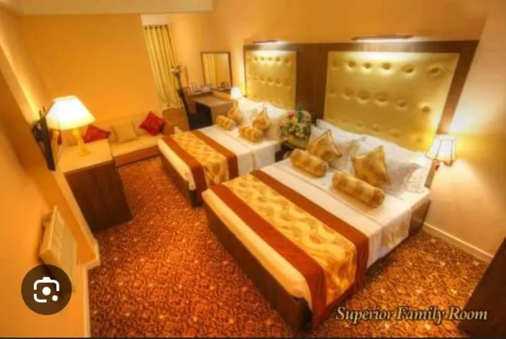 Bed in The Queensburry City Hotel